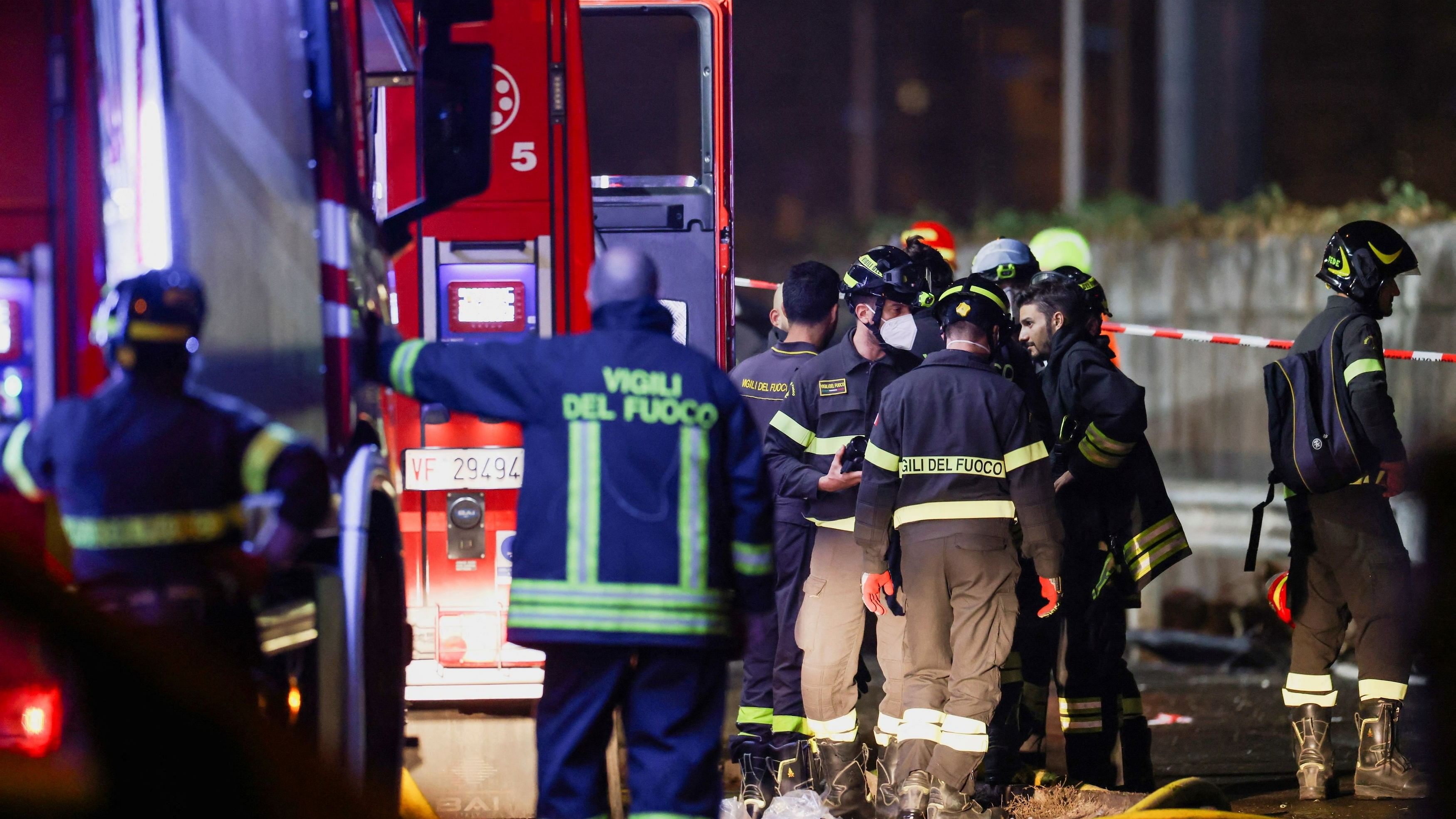 <div class="paragraphs"><p>Firefighters work near a coach after it crashed off an overpass near Venice, in Mestre, Italy, October 4, 2023. </p></div>