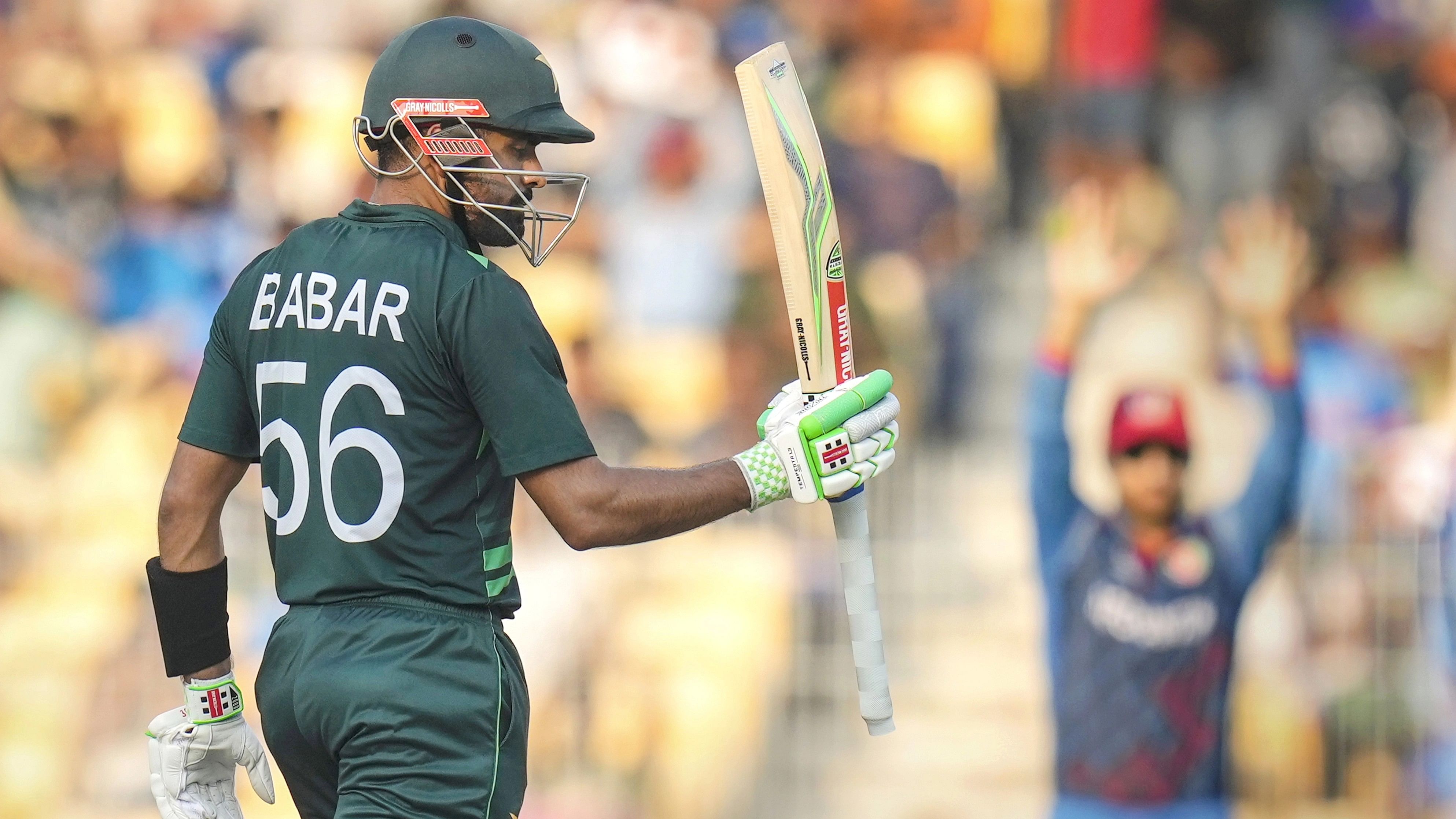 <div class="paragraphs"><p>Pakistan's batter Babar Azam celebrates after his half-century during the ICC Men's Cricket World Cup 2023 match between Pakistan and Afghanistan, at M. A. Chidambaram Stadium, in Chennai, Monday, Oct. 23, 2023. </p></div>