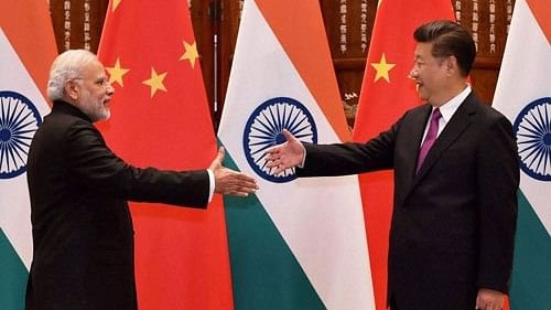 <div class="paragraphs"><p>Xi and Modi</p></div>