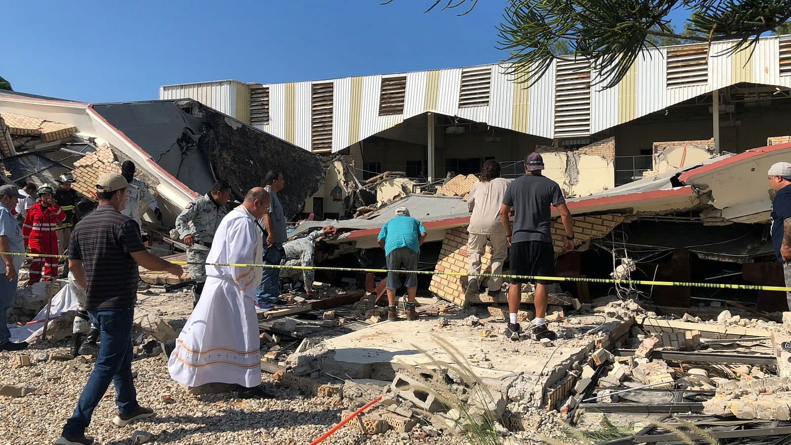 <div class="paragraphs"><p>Members of security forces, people and a priest work at a site where a church roof collapsed during Sunday mass in Ciudad Madero, in Tamaulipas state, Mexico in this handout picture distributed to Reuters on October 1, 2023. </p></div>