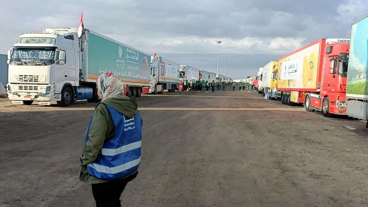<div class="paragraphs"><p>Trucks carrying humanitarian aid from Egyptian NGOs for Palestinians, wait for the reopening of the Rafah crossing at the Egyptian side.&nbsp;</p></div>