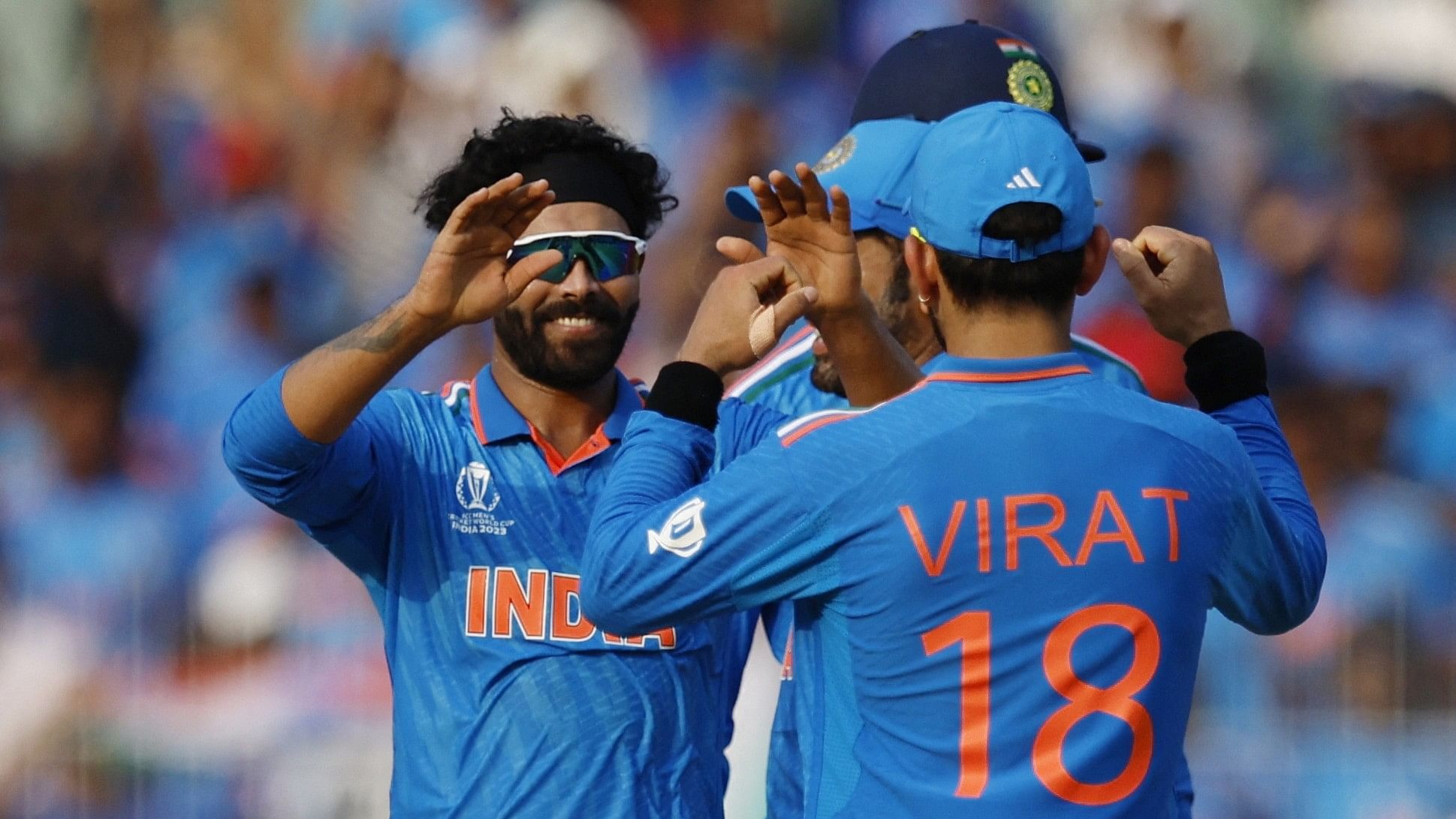 <div class="paragraphs"><p> Ravindra Jadeja celebrates with teammate Virat Kohli after taking the wicket of Australia's Marnus Labuschagne, caught by K L Rahul.</p></div>