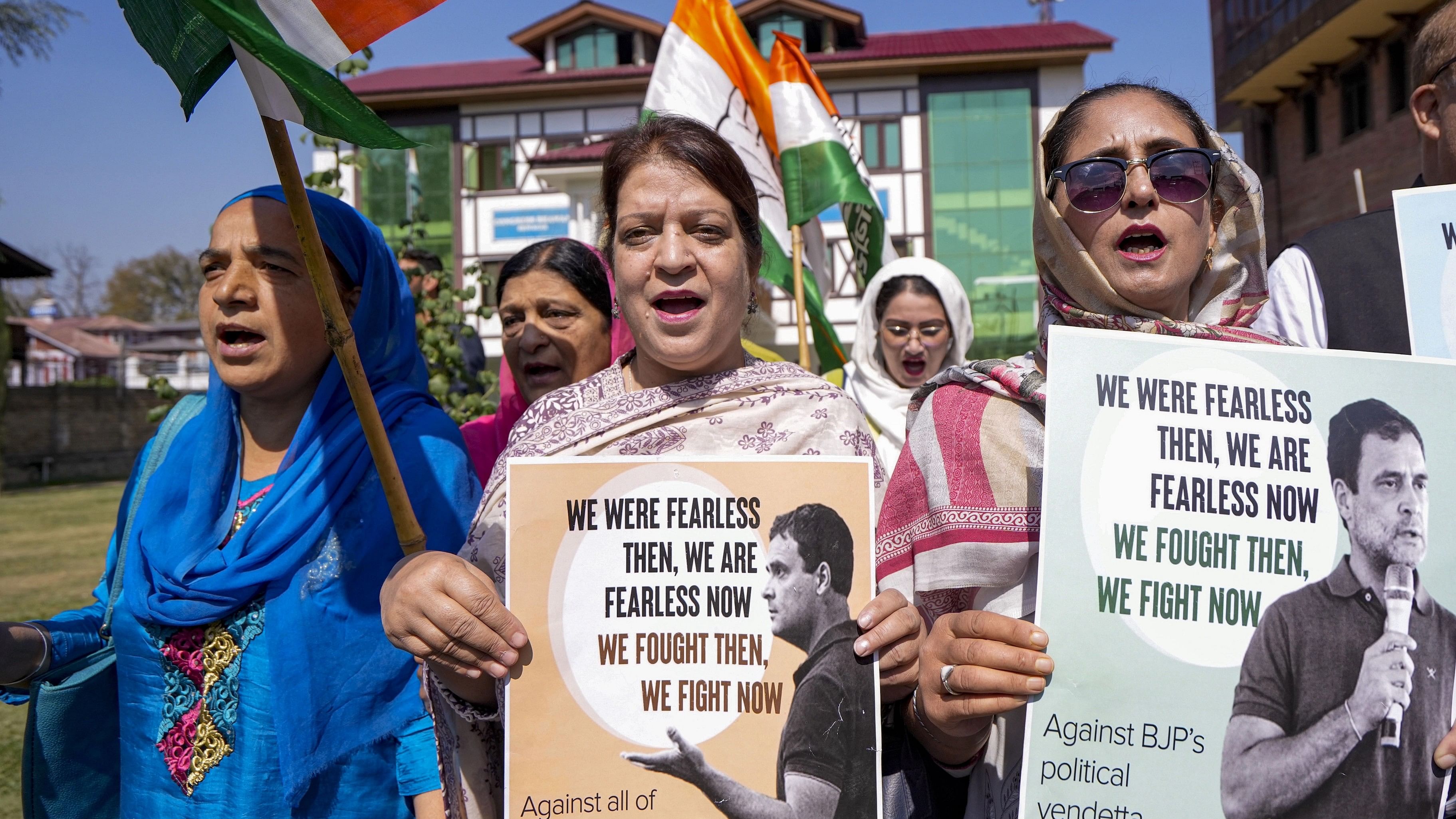 <div class="paragraphs"><p>Congress party members shout slogans during a protest against BJP over circulation of an objectionable poster of Rahul Gandhi in Srinagar.</p></div>