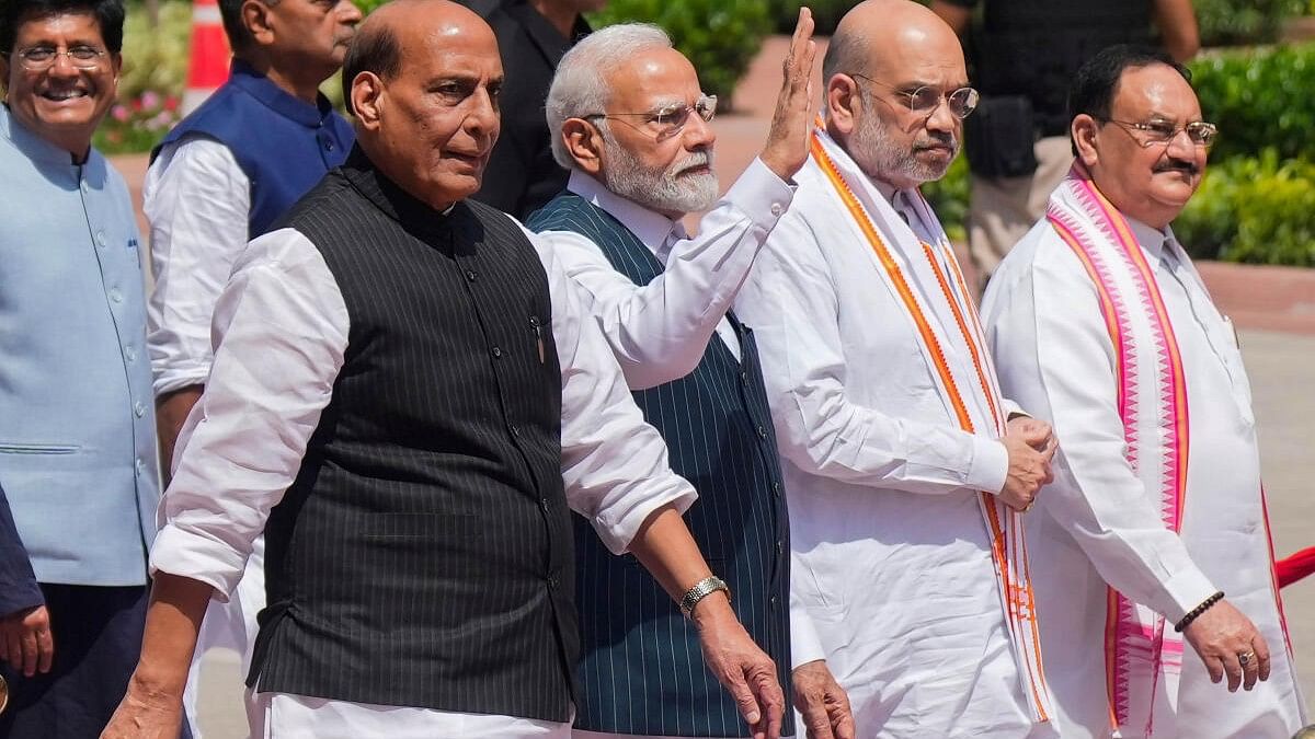 <div class="paragraphs"><p>PM Narendra Modi, flanked by Rajnath Singh on the right, and Amit Shah and J P Nadda on the left.</p></div>