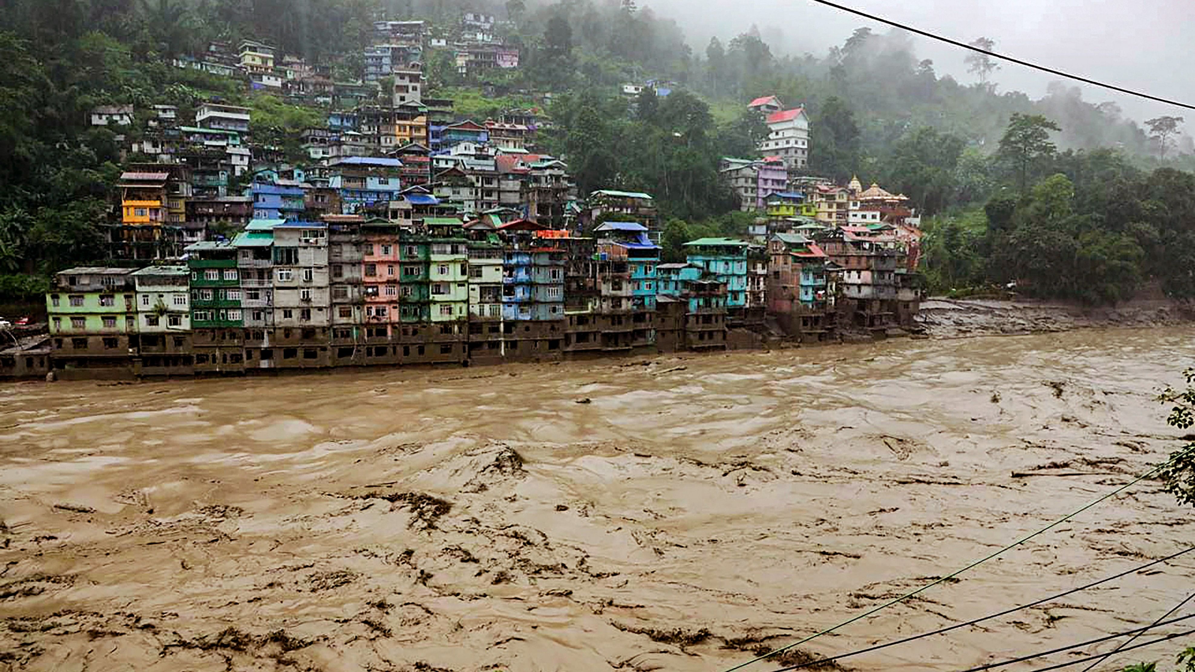 <div class="paragraphs"><p>Flooded Teesta river in north Sikkim, Wednesday, Oct. 4, 2023. A sudden cloud burst over Lhonak Lake in North Sikkim on Wednesday has resulted in a flash flood in the Teesta River in Lachen valley, which was compounded by the release of water from a dam.</p></div>