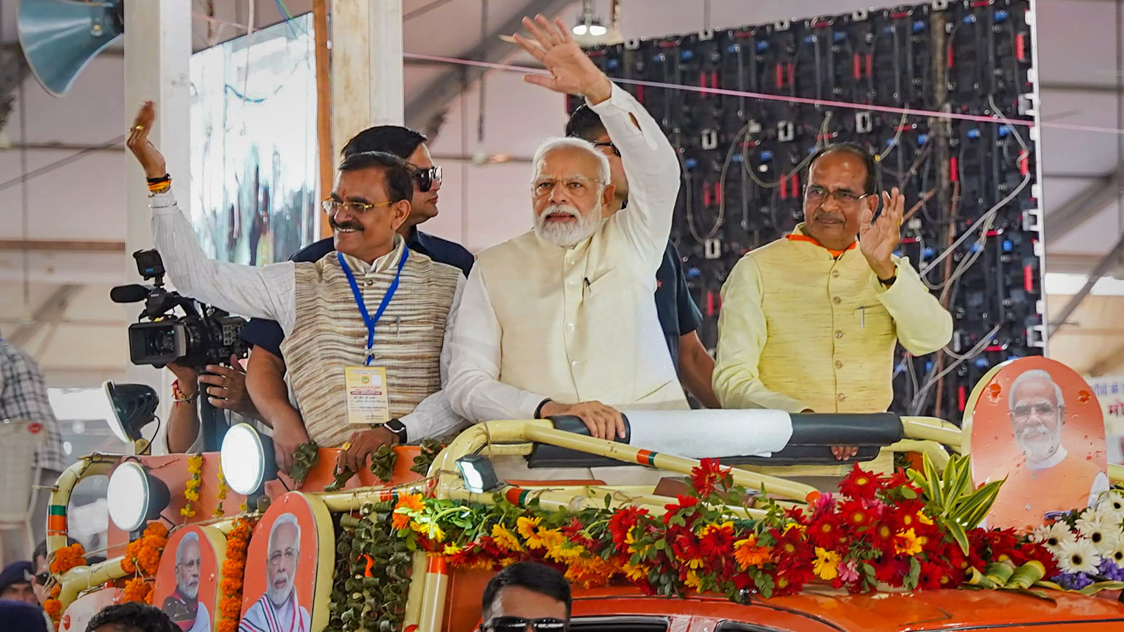 <div class="paragraphs"><p>Prime Minister Narendra Modi waves at supporters as he arrives for an event organised for laying of foundation stone of various developmental projects, in Gwalior.</p></div>