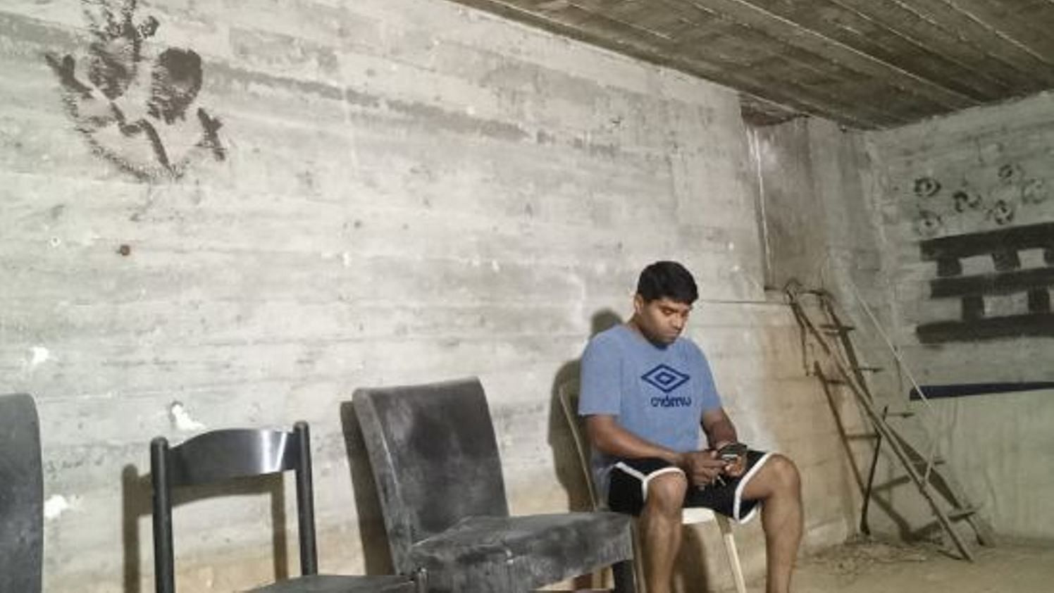 Praveen Pinto from Kinnigoli near Mangaluru takes shelter at a bunker in Tel Aviv.