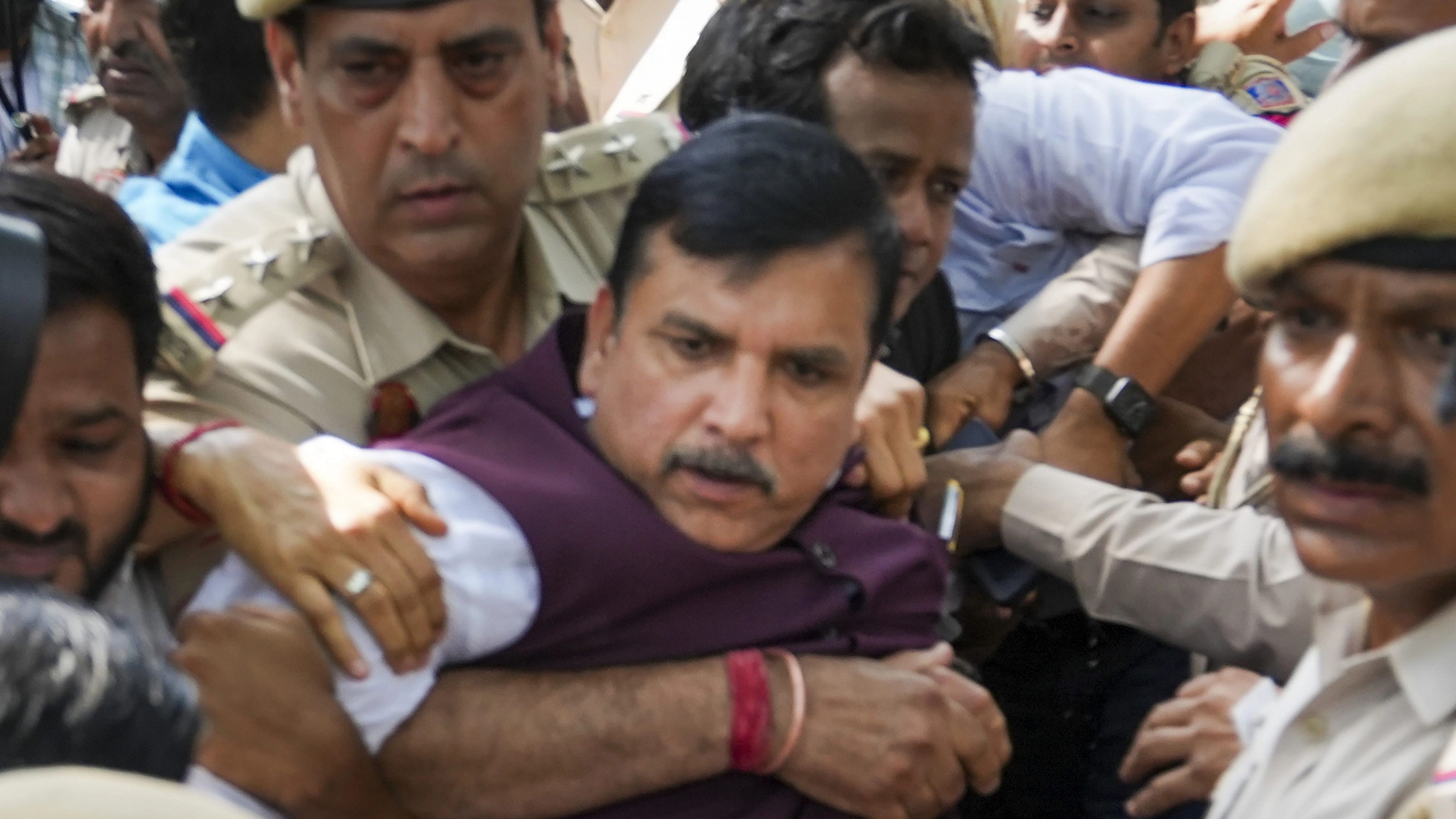 <div class="paragraphs"><p>  AAP MP Sanjay Singh being detained by police personnel in New Delhi. </p></div>