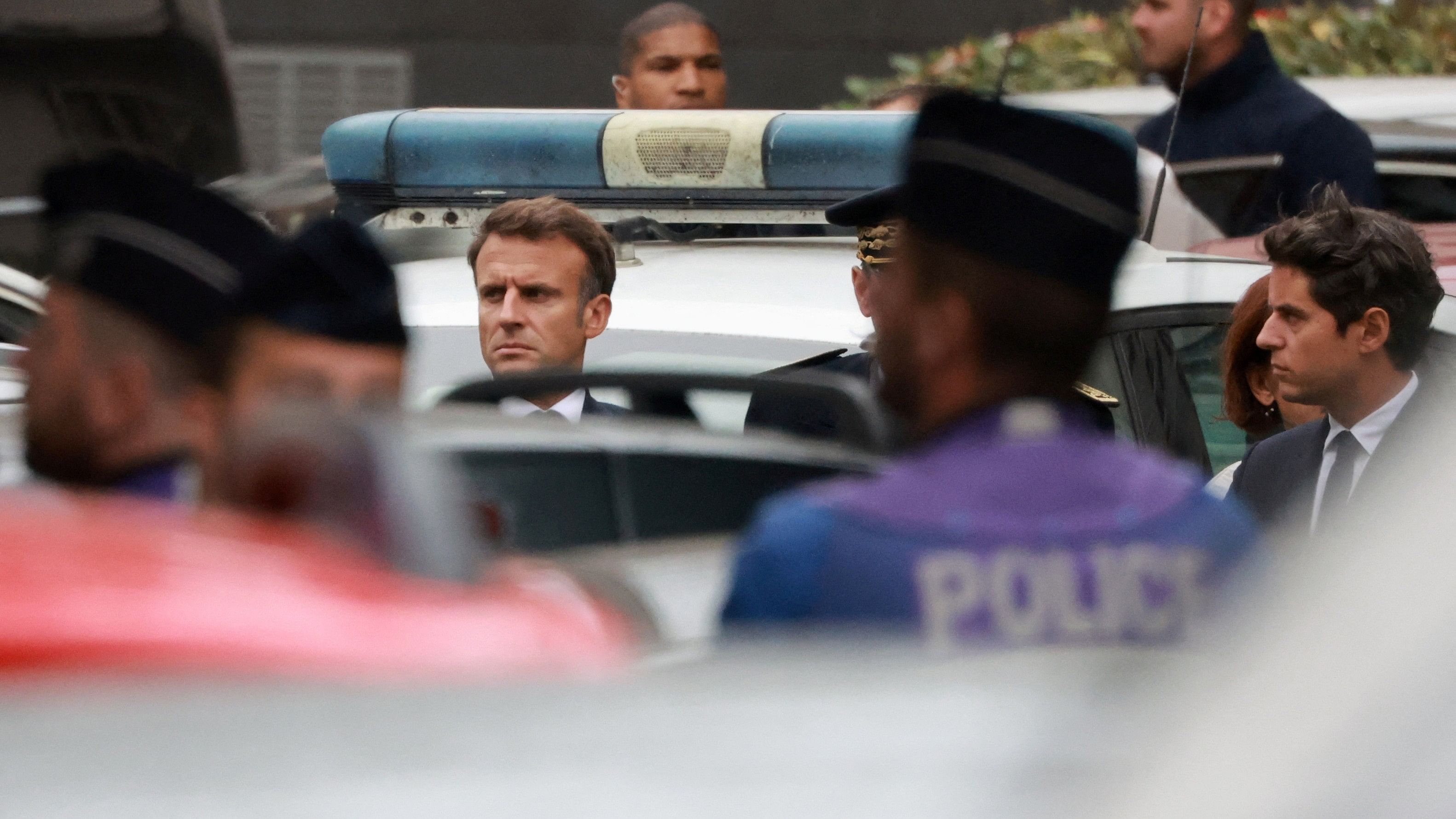 <div class="paragraphs"><p>French President Emmanuel Macron and Education and Youth Minister Gabriel Attal arrive at the site after a teacher was killed and several people injured in a knife attack at the Lycee Gambetta-Carnot high school in Arras, northern France.</p></div>