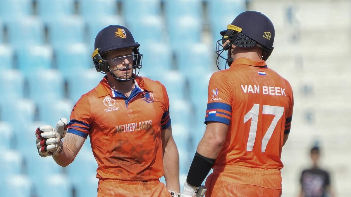 <div class="paragraphs"><p>Netherlands' Sybrand Engelbrecht, left, being congratulated by batting partner Logan van Beek after he scored fifty during the ICC Men’s Cricket World Cup 2023 match between Sri Lanka and Netherlands, at Bharat Ratna Shri Atal Bihari Vajpayee Ekana Cricket Stadium in Lucknow.</p></div>