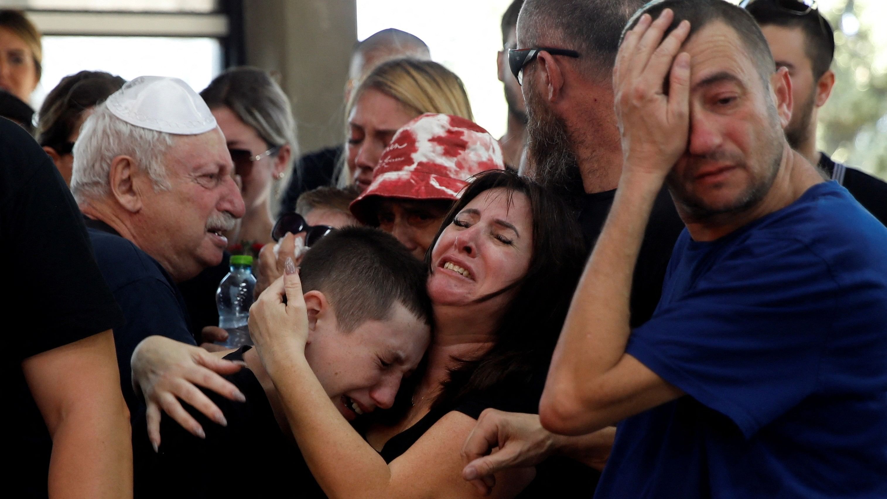 <div class="paragraphs"><p>Friends and family mourn Daniella Dana Petrenko, from Haifa who was killed in a deadly attack by Hamas gunmen at a festival, which she attended with her boyfriend, at her funeral.</p></div>