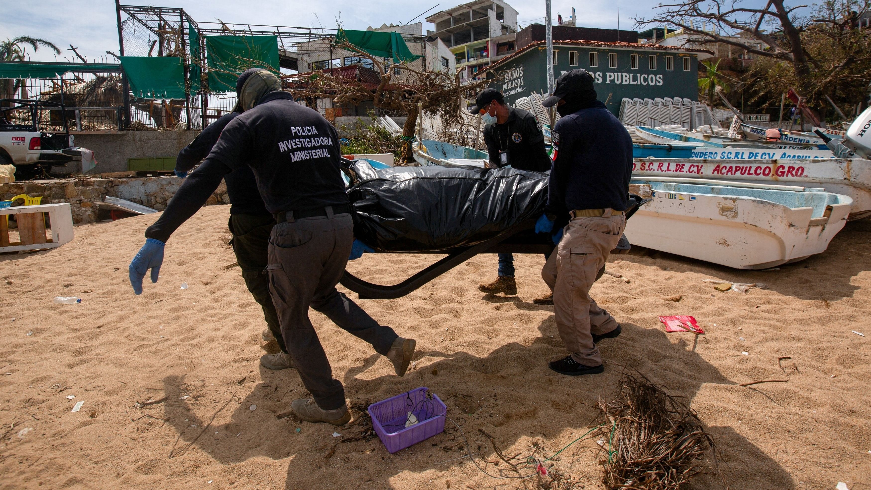 <div class="paragraphs"><p>Members of the emergency services carry a dead body retrieved from the sea in the aftermath of Hurricane Otis, in Acapulco, Mexico, October 28, 2023. </p></div>