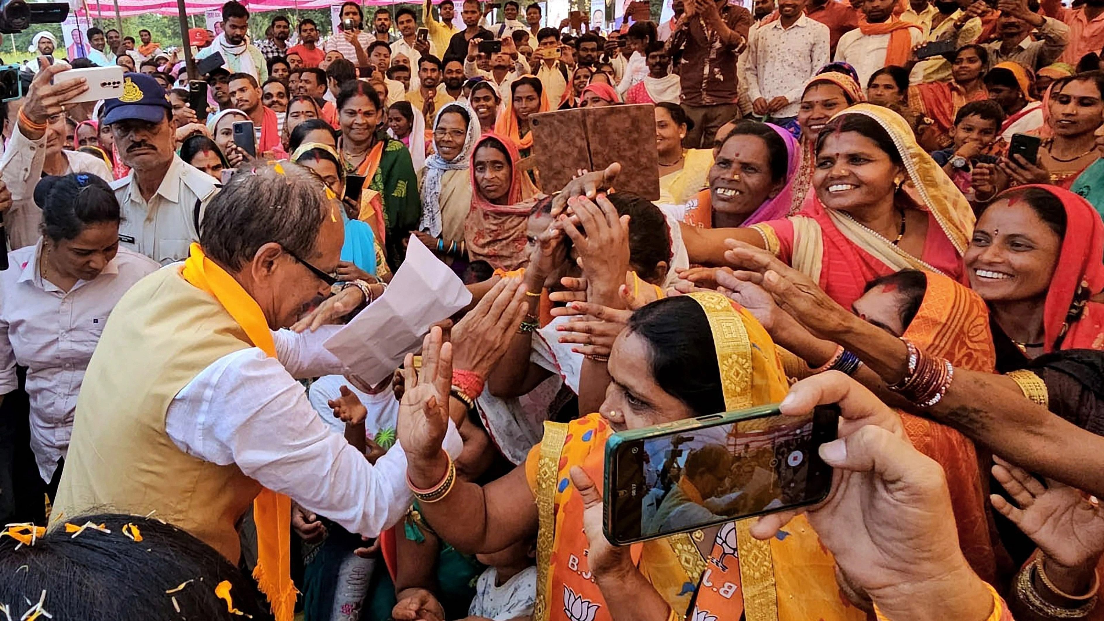 <div class="paragraphs"><p>Madhya Pradesh Chief Minister Shivraj Singh Chouhan greets the public while campaigning for the upcoming state assembly elections.</p></div>