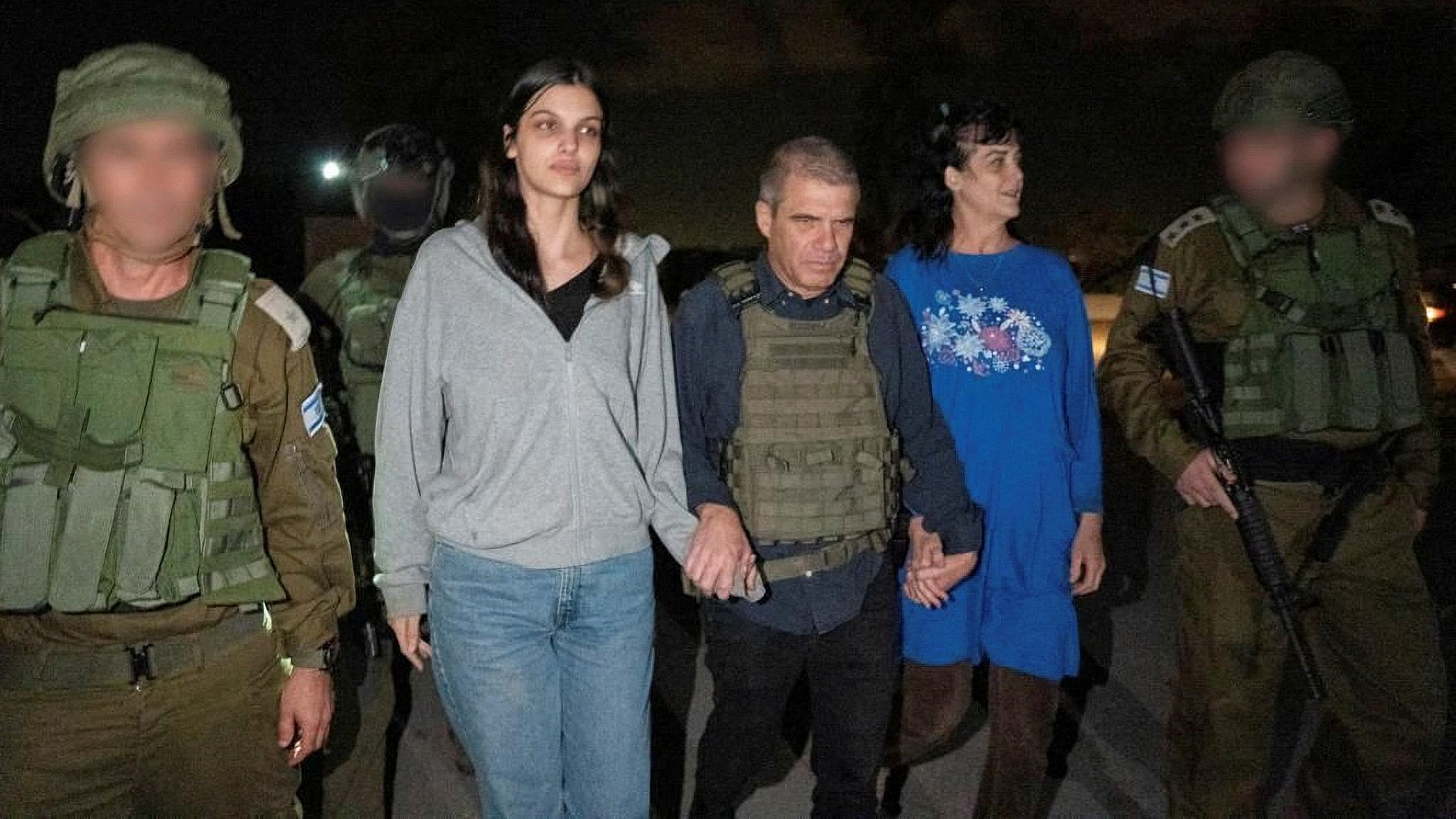 <div class="paragraphs"><p>Judith Tai Raanan and her daughter Natalie Shoshana Raanan, US citizens who were taken as hostages by Palestinian Hamas militants, walk while holding hands with Brig.-Gen.  Gal Hirsch, Israel's Coordinator for the Captives and Missing, after they were released by the militants, in response to Qatari mediation efforts, in this handout picture obtained by Reuters on October 20, 2023.</p></div>