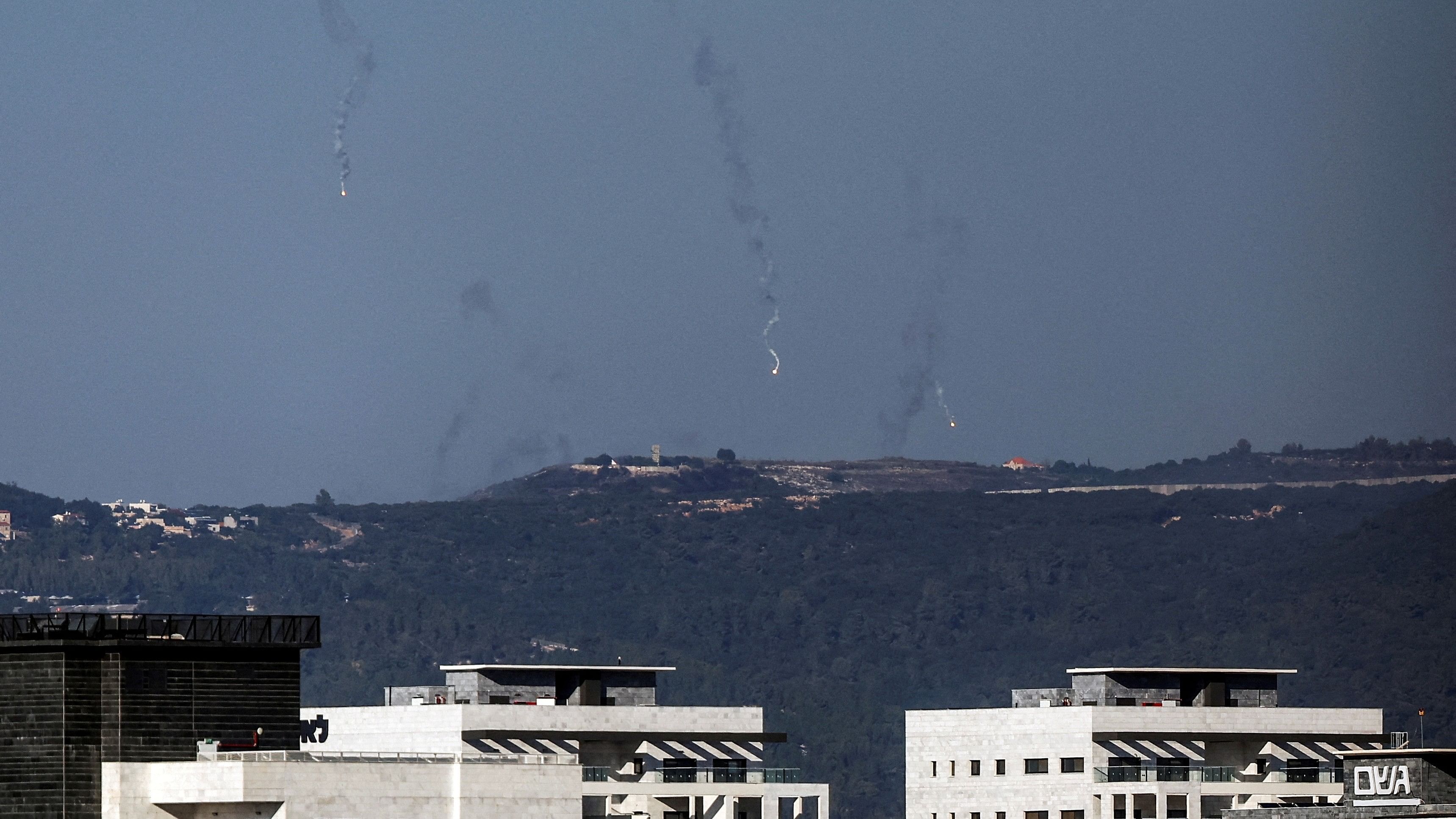 <div class="paragraphs"><p>A view shows illumination flares in the sky by Israel's border with Lebanon, in northern Israel, as seen from its Israeli side October 21, 2023. </p></div>