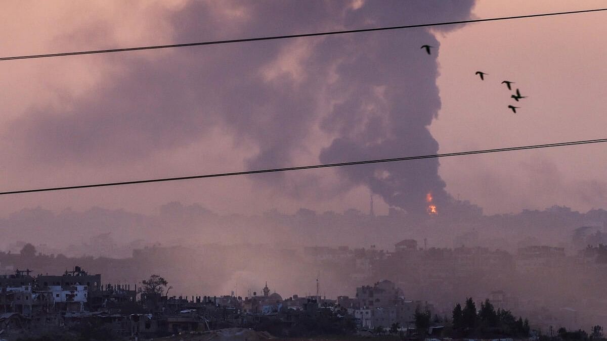 <div class="paragraphs"><p>Smoke rises over Gaza, as seen from Israel's border with Gaza, in southern Israel.</p></div>