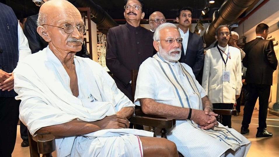 <div class="paragraphs"><p>Prime Minister Narendra Modi near the statue of Mahatma Gandhi at the National Museum of Indian Cinema in Mumbai.</p></div>