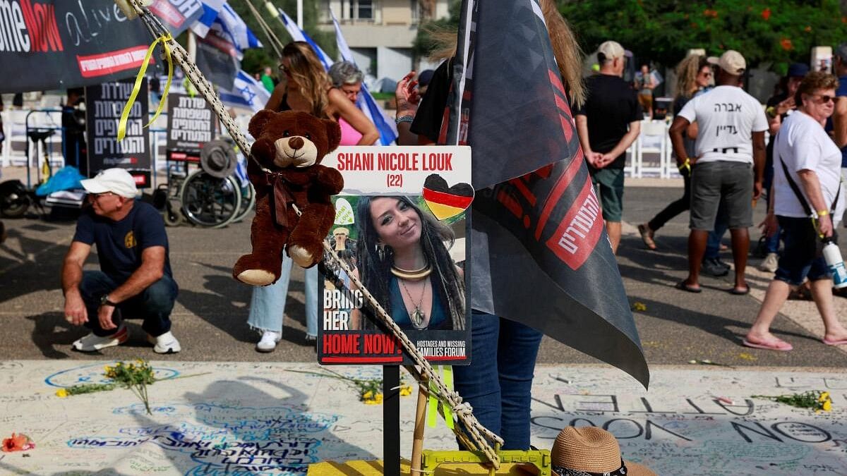 <div class="paragraphs"><p>A picture of Shani Nicole Louk, who is missing, is displayed during a demonstration by family members and supporters of hostages who are being held in Gaza after they were kidnapped from Israel by Hamas gunmen.</p></div>