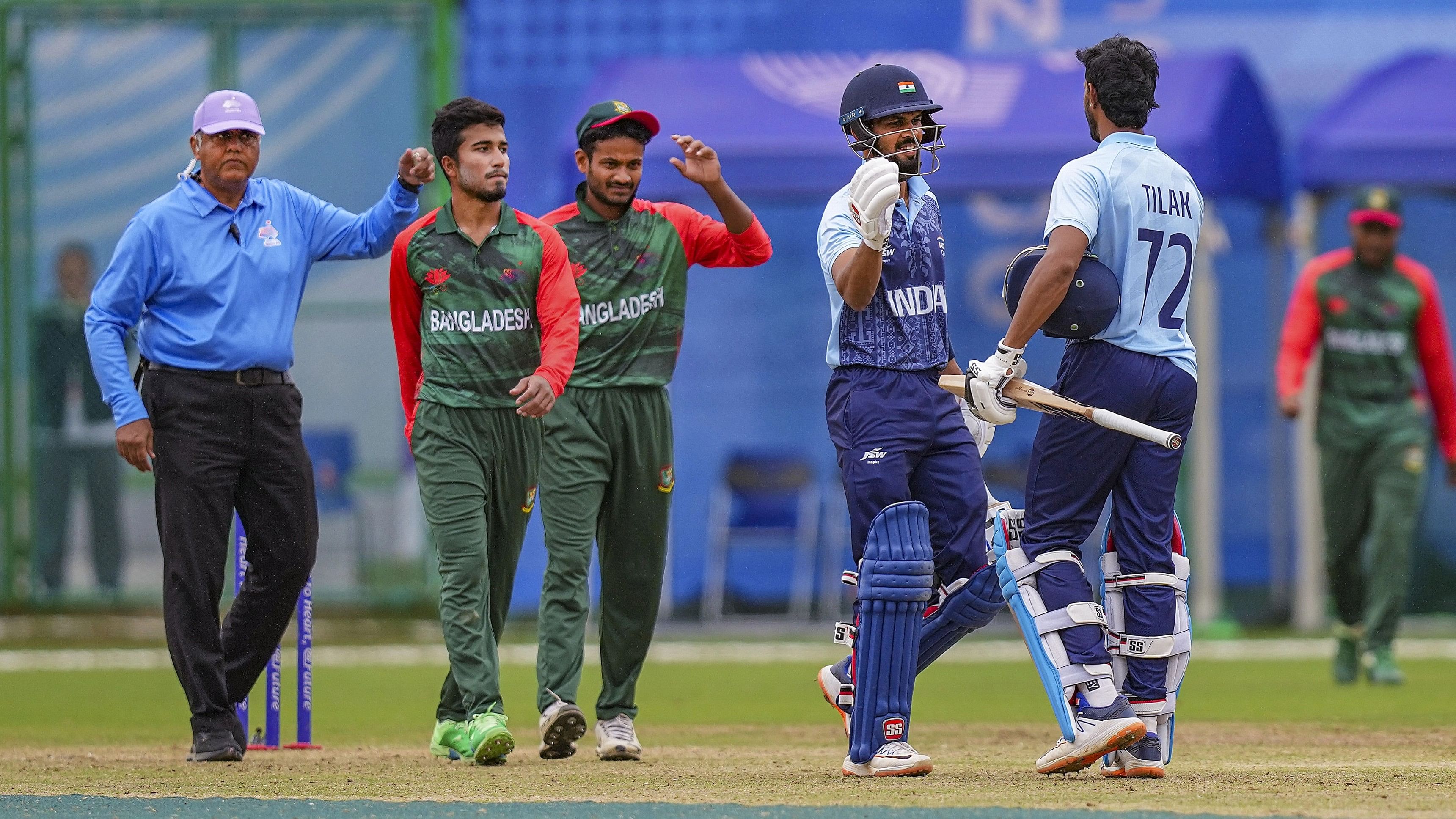<div class="paragraphs"><p> India's Tilak Varma and R Gaikwad celebrate their win in men's cricket semifinal match between India and Bangladesh at the 19th Asian Games.</p></div>