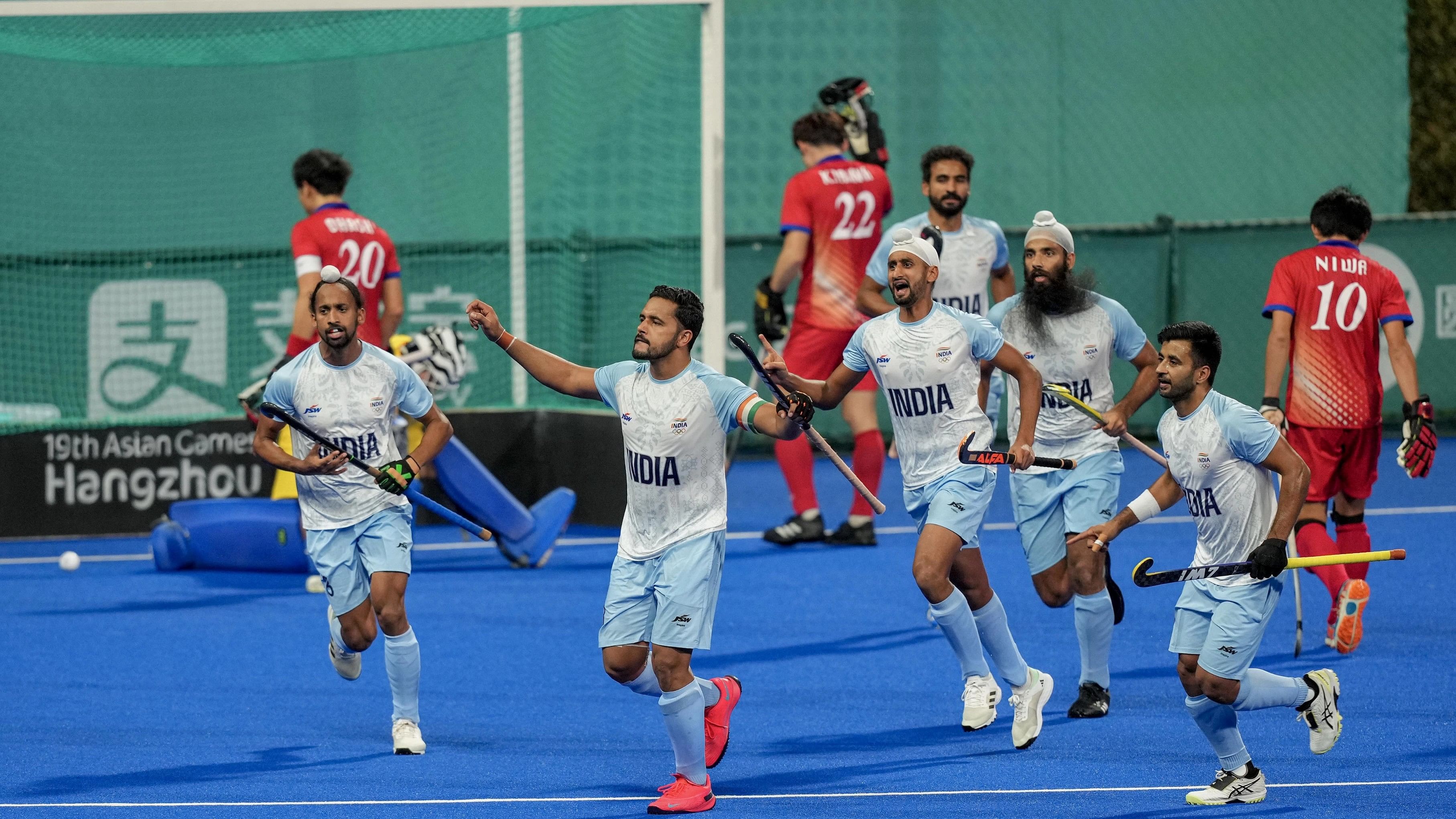 <div class="paragraphs"><p>India's captain Harmanpreet Singh celebrates with teammates after scoring a goal against Japan during the Men's Hockey Final match at the 19th Asian Games  </p></div>