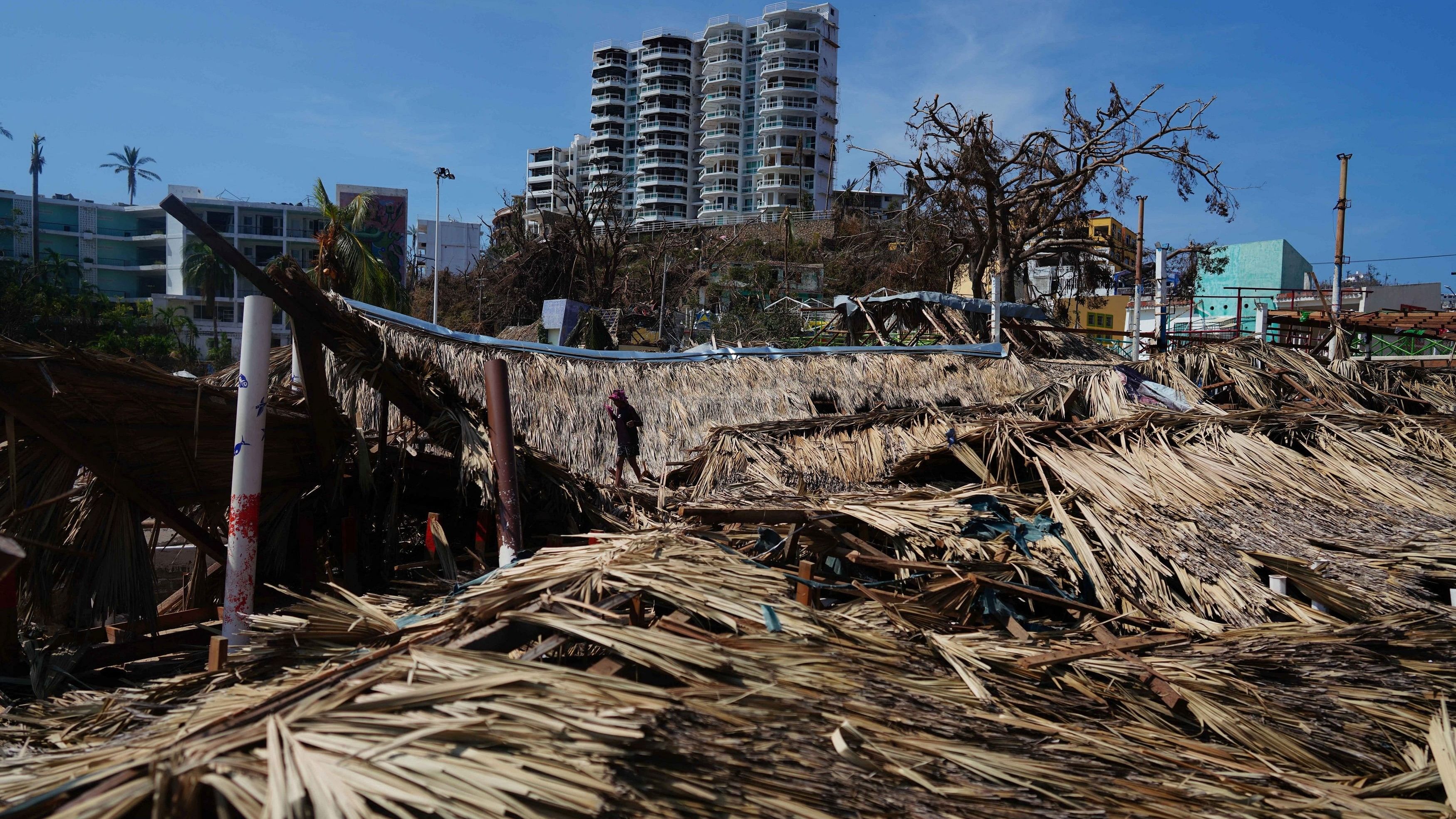 <div class="paragraphs"><p>A child walks over destroyed roofs in the aftermath of Hurricane Otis in Acapulco, Mexico, October 29, 2023.</p></div>