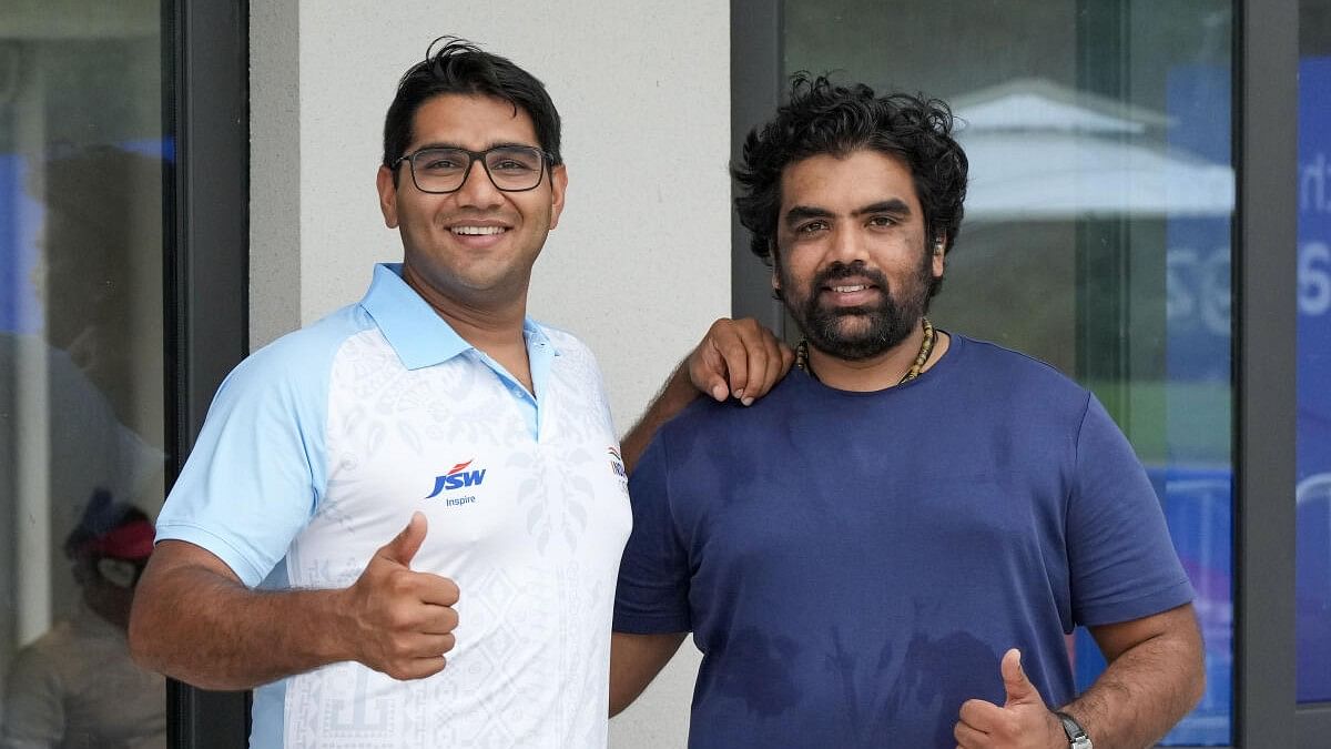 <div class="paragraphs"><p>Indian shooters Kynan Darius Chenai and Prithviraj Tondaiman pose for a photo after the Trap-75 Team Men (Phase 1) event at the 19th Asian Games, in Hangzhou, China, Saturday, Sept. 30, 2023.</p></div>