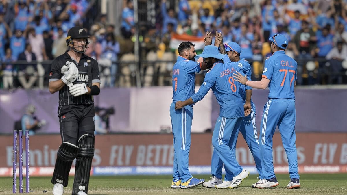 <div class="paragraphs"><p>India's bowler Mohammed Shami celebrates with teammates after the wicket of New Zealand's batter Will Young during the ICC Men's Cricket World Cup 2023 match between India and New Zealand, at the HPCA Stadium in Dharamshala</p></div>