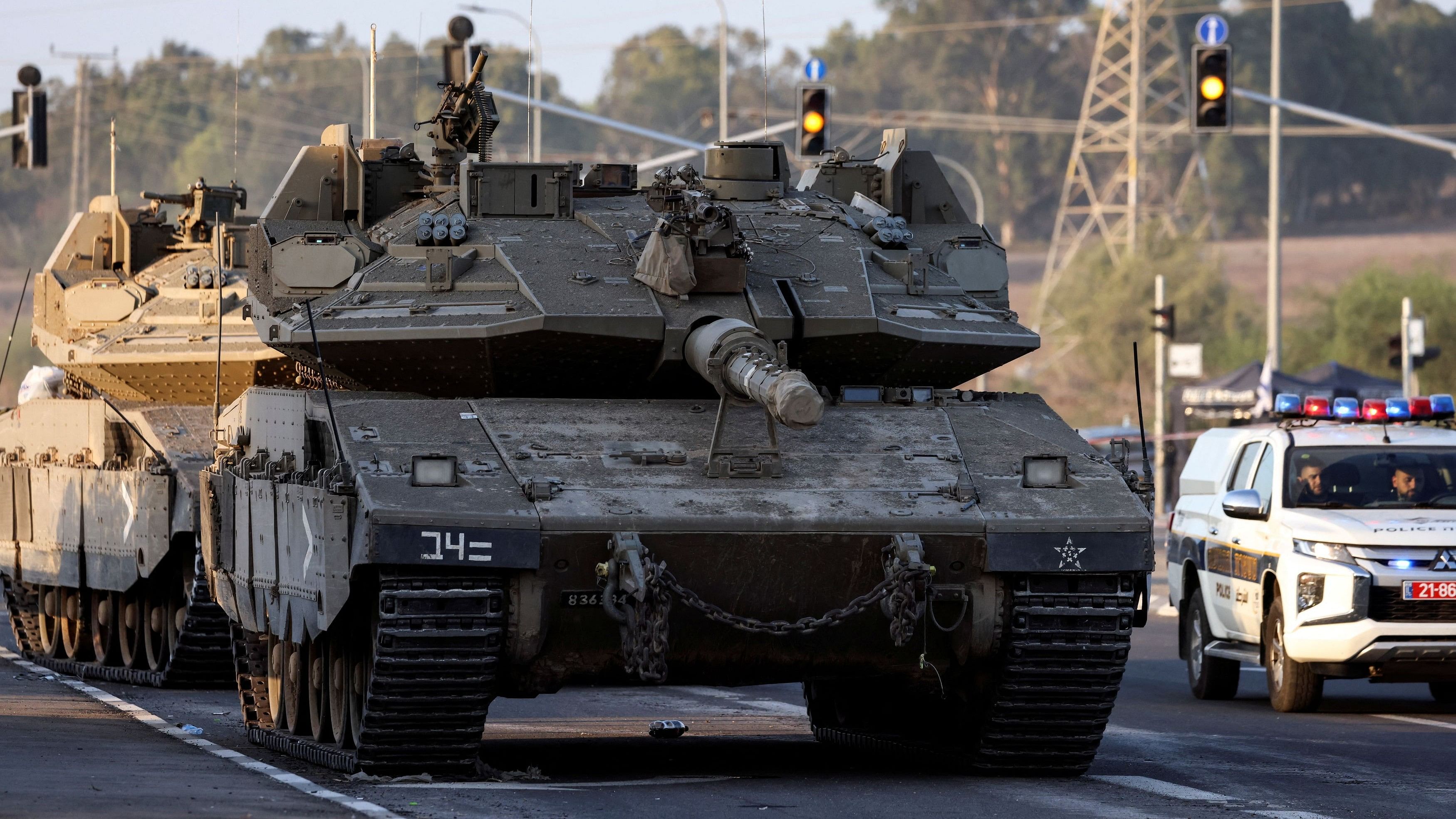 <div class="paragraphs"><p>Israeli tanks seen on a road near Israel's border with the Gaza Strip.</p></div>