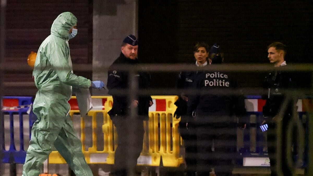 <div class="paragraphs"><p>A person works as Belgian police secure the area after a shooting in Brussels, Belgium, October 16, 2023.</p></div>