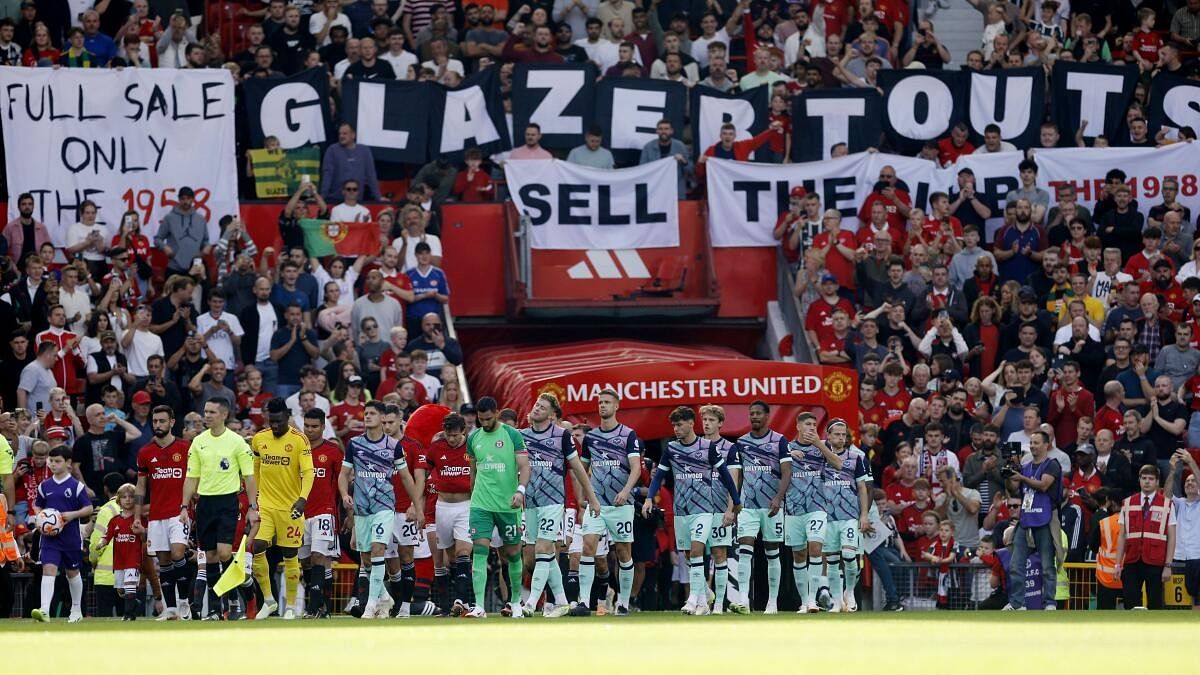 <div class="paragraphs"><p>Manchester United fans display banners in protest against the ownership of the club.</p></div>