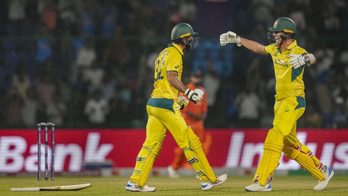 <div class="paragraphs"><p>Australian batter Glenn Maxwell celebrates with teammate Pat Cummins after his century during the ICC Men's Cricket World Cup 2023 match between Australia and Netherlands, at the Arun Jaitley Stadium, in New Delhi, Wednesday, Oct. 25, 2023.</p></div>