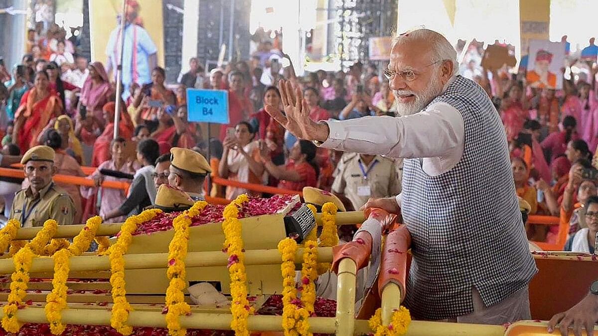 <div class="paragraphs"><p>Prime Minister Narendra Modi waves at crowd as he arrives for a public meeting, in Jodhpur, Thursday, Oct. 5, 2023.</p></div>