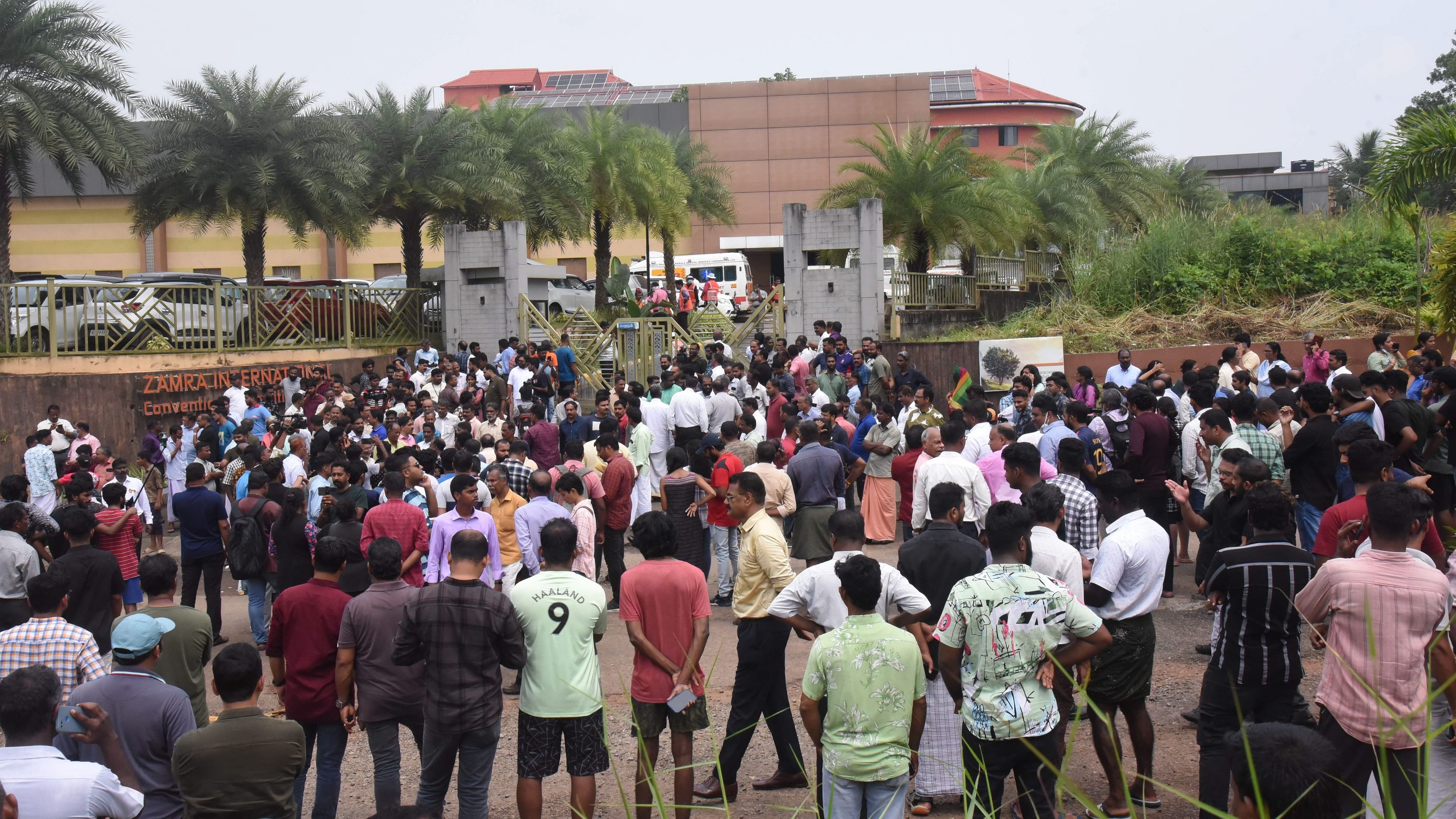 <div class="paragraphs"><p>People gather after an explosion that killed a woman and injured several others, at a convention centre in Kochi.</p></div>