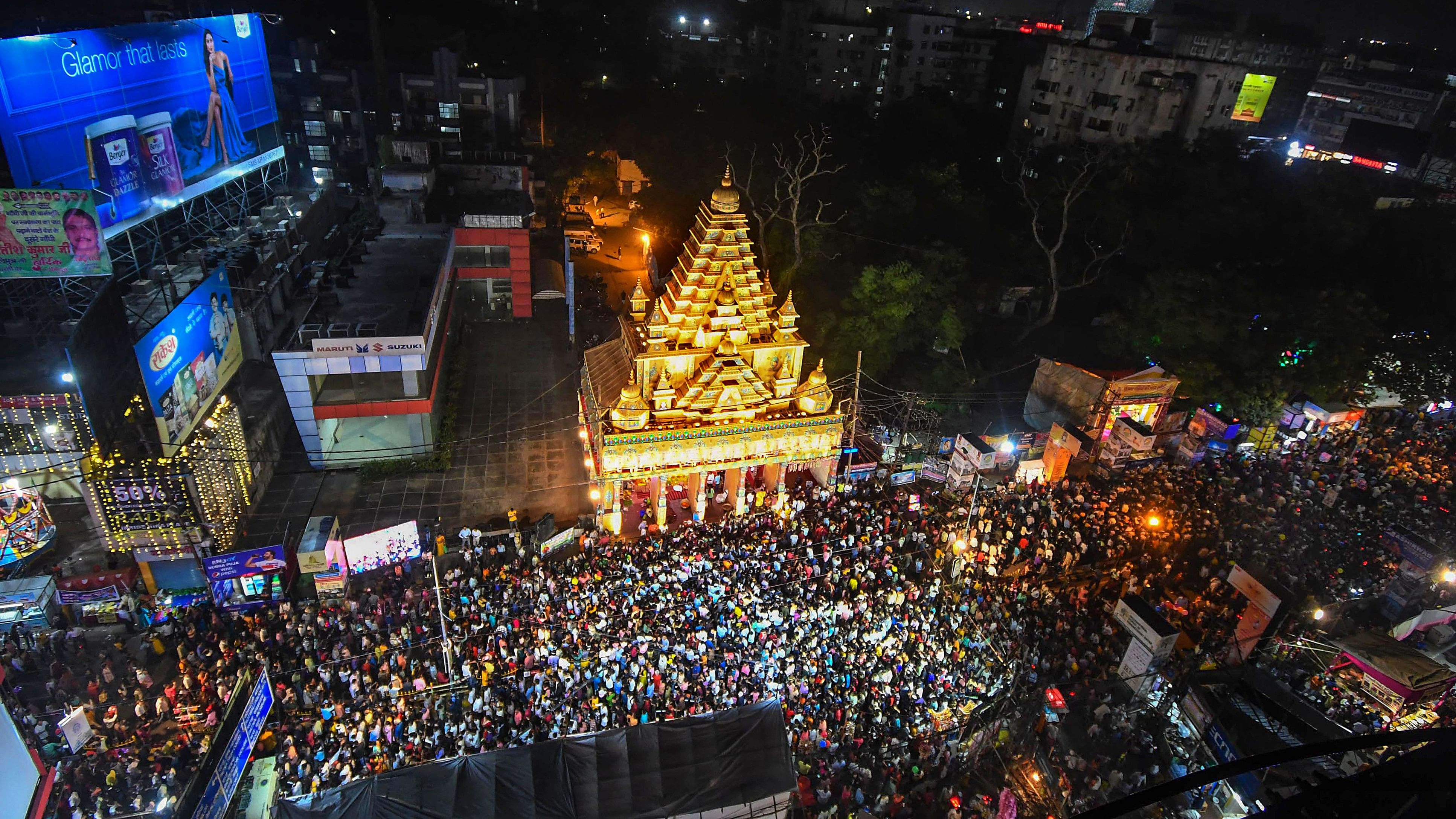 <div class="paragraphs"><p>People gather at a 'puja pandal' during 'Maha Navami' of Durga Puja celebrations, in Patna, Monday, Oct. 23, 2023.</p></div>