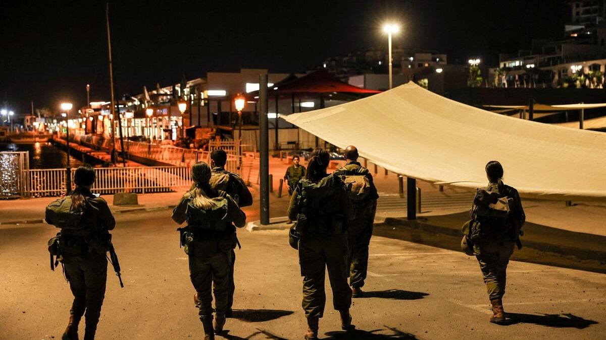 <div class="paragraphs"><p>Israeli soldiers patrol the promenade a day after a mass-infiltration by Hamas gunmen from the Gaza Strip into Israel, in Ashkelon, southern Israel.</p></div>