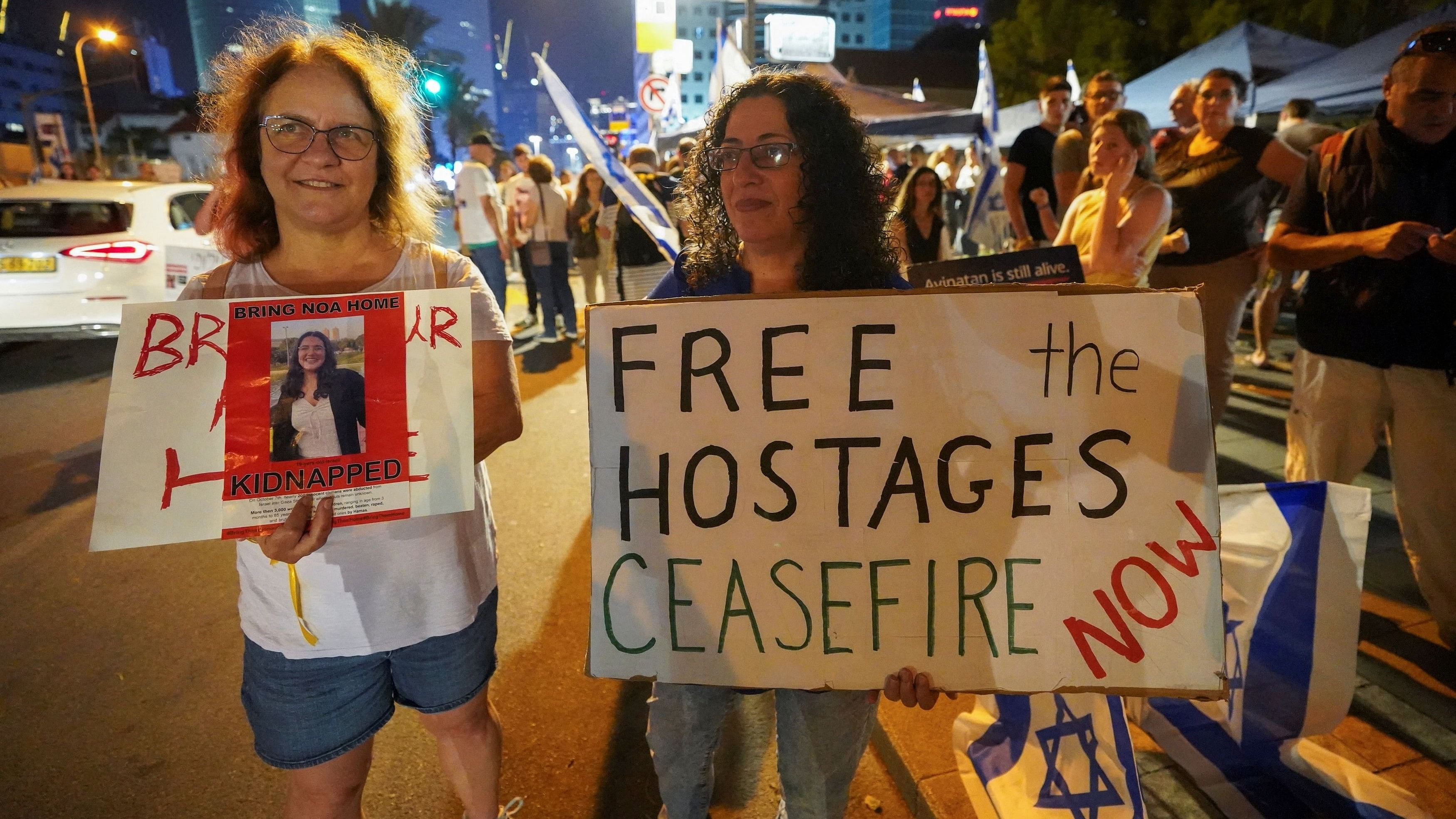 <div class="paragraphs"><p>People hold placards during a demonstration to show support and solidarity with the families of hostages who are being held in Gaza, amid the ongoing conflict between Israel and Hamas, in Tel Aviv, Israel, October 21, 2023. </p></div>