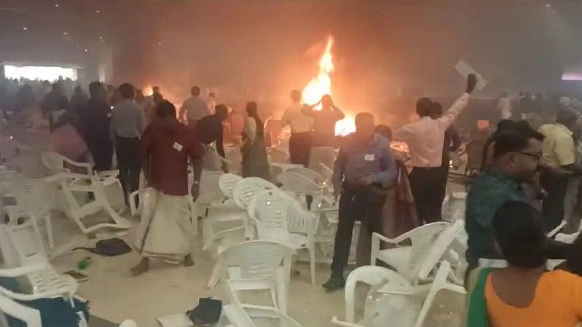 <div class="paragraphs"><p>People rush to save themselves after a blast at a convention centre in Kalamassery, in Ernakulam district, Sunday, Oct. 29, 2023. At least one person died and over 20 were injured, according to police.</p></div>