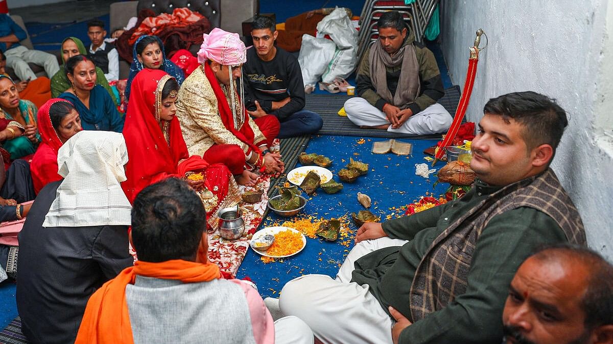 <div class="paragraphs"><p>People during a marriage ceremony at a community centre, even as Pakistan Rangers fired without provocation along the international border in Arnia sector of Jammu &amp; Kashmir.</p></div>