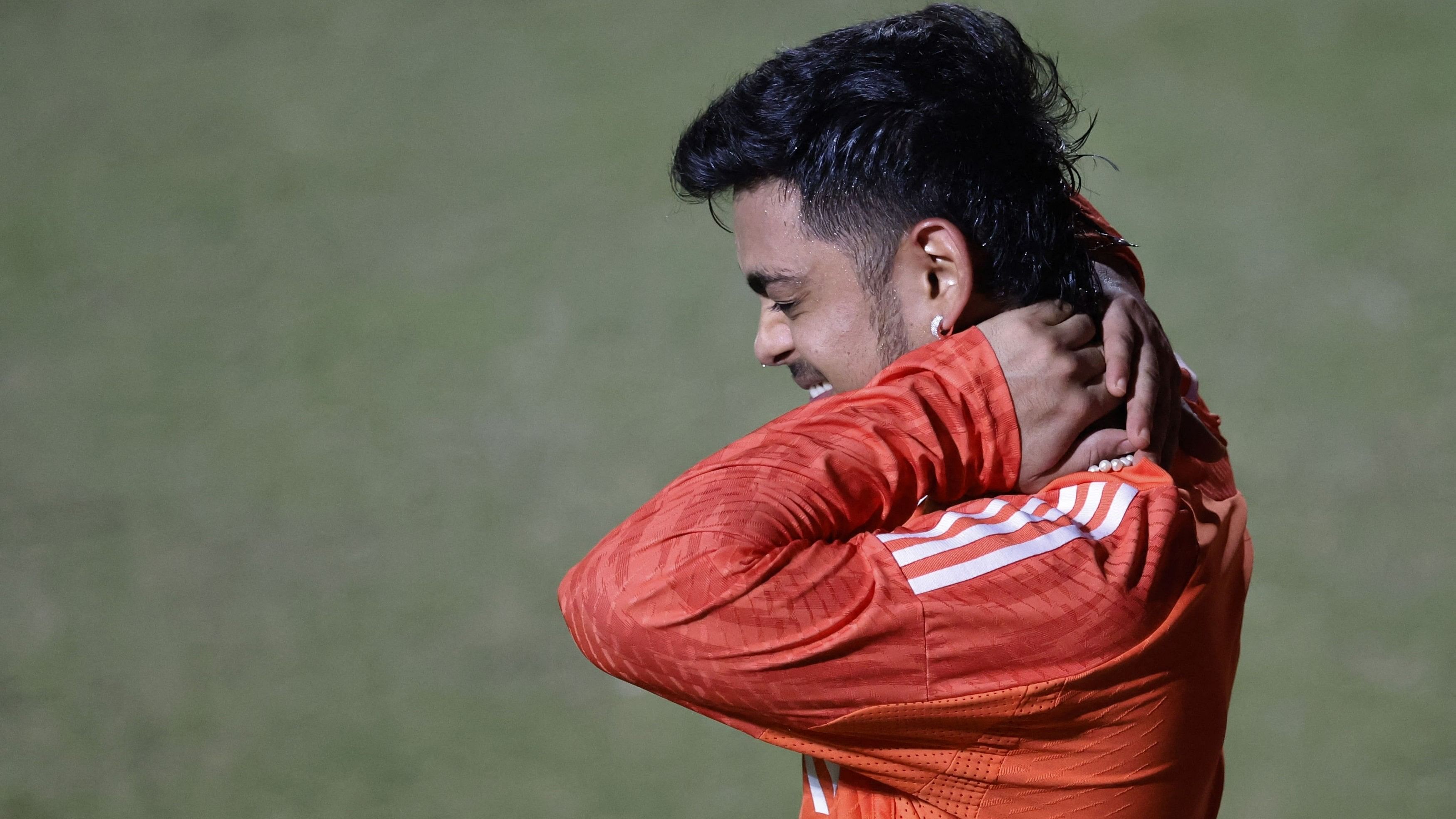 <div class="paragraphs"><p> India's Ishan Kishan reacts after sustaining an injury during practice.</p></div>