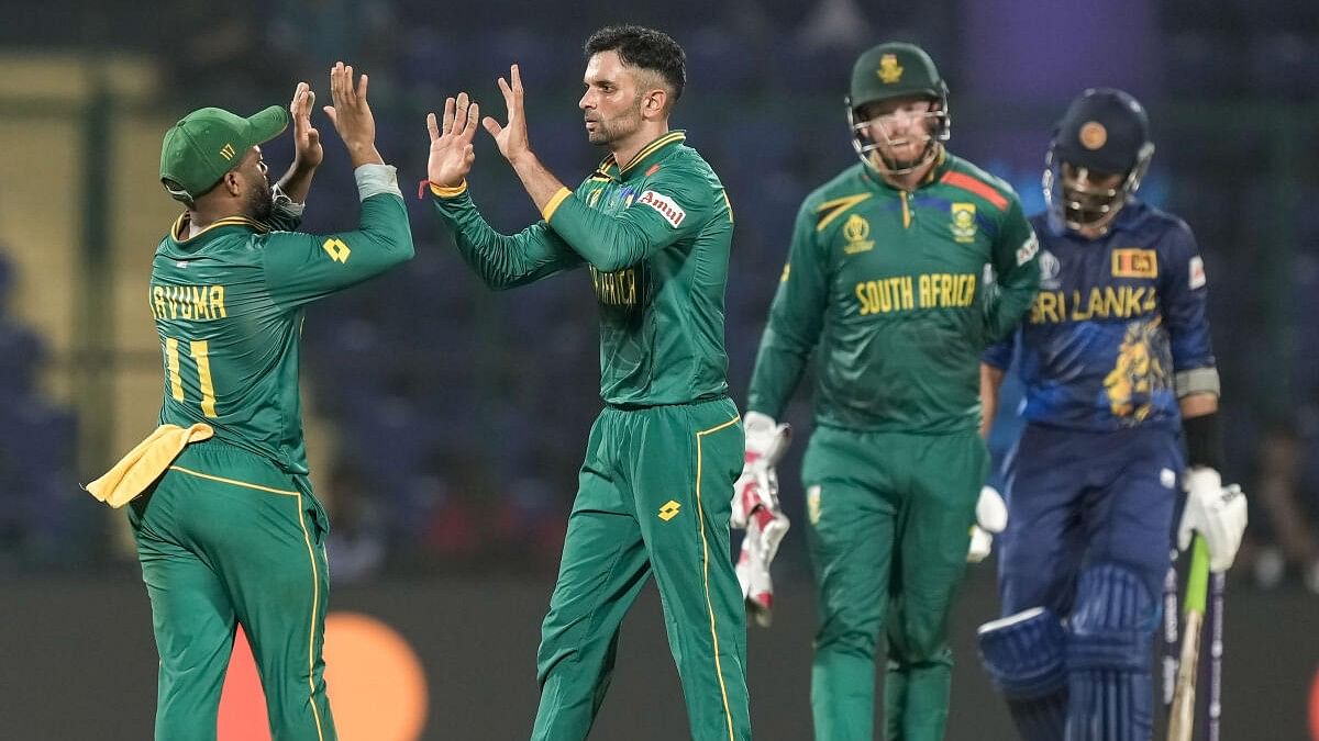 <div class="paragraphs"><p>South Africa's bowler Keshav Maharaj celebrates the wicket of Sri Lanka's batter Dasun Shanaka during the ICC Men's Cricket World Cup match between Sri Lanka and South Africa, at the Arun Jaitley Stadium, in New Delhi, Saturday, Oct. 7, 2023.</p></div>