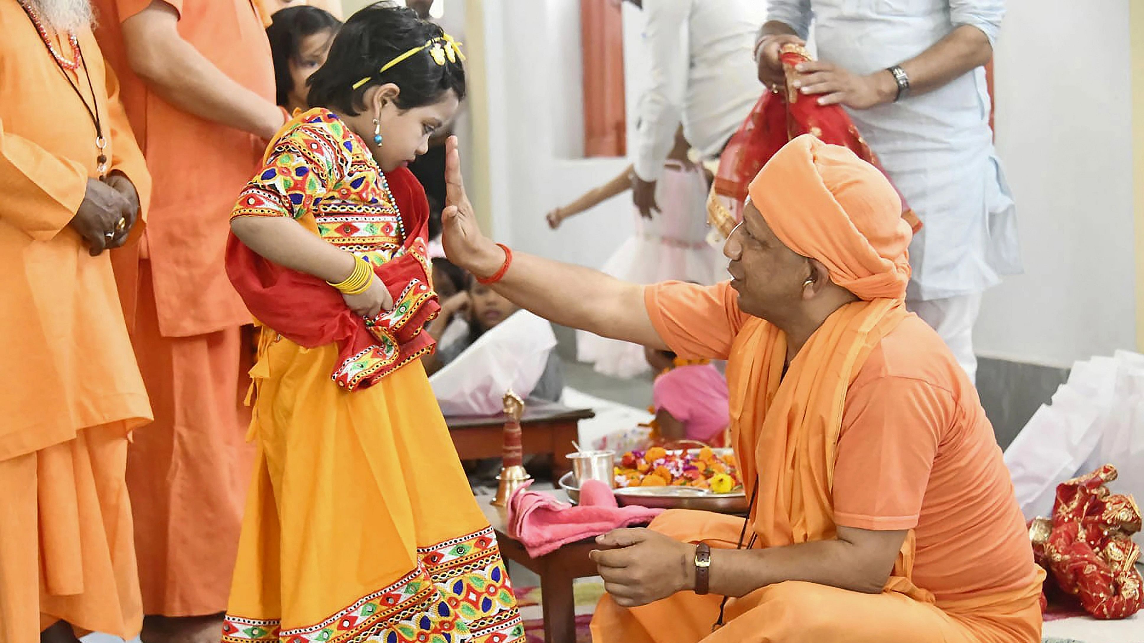<div class="paragraphs"><p>Uttar Pradesh Chief Minister Yogi Adityanath during 'Kanya Puja' on 'Navami' amid the ongoing 'Navratri' festival, at Gorakhnath Temple in Gorakhpur, Monday, Oct. 23, 2023. </p></div>