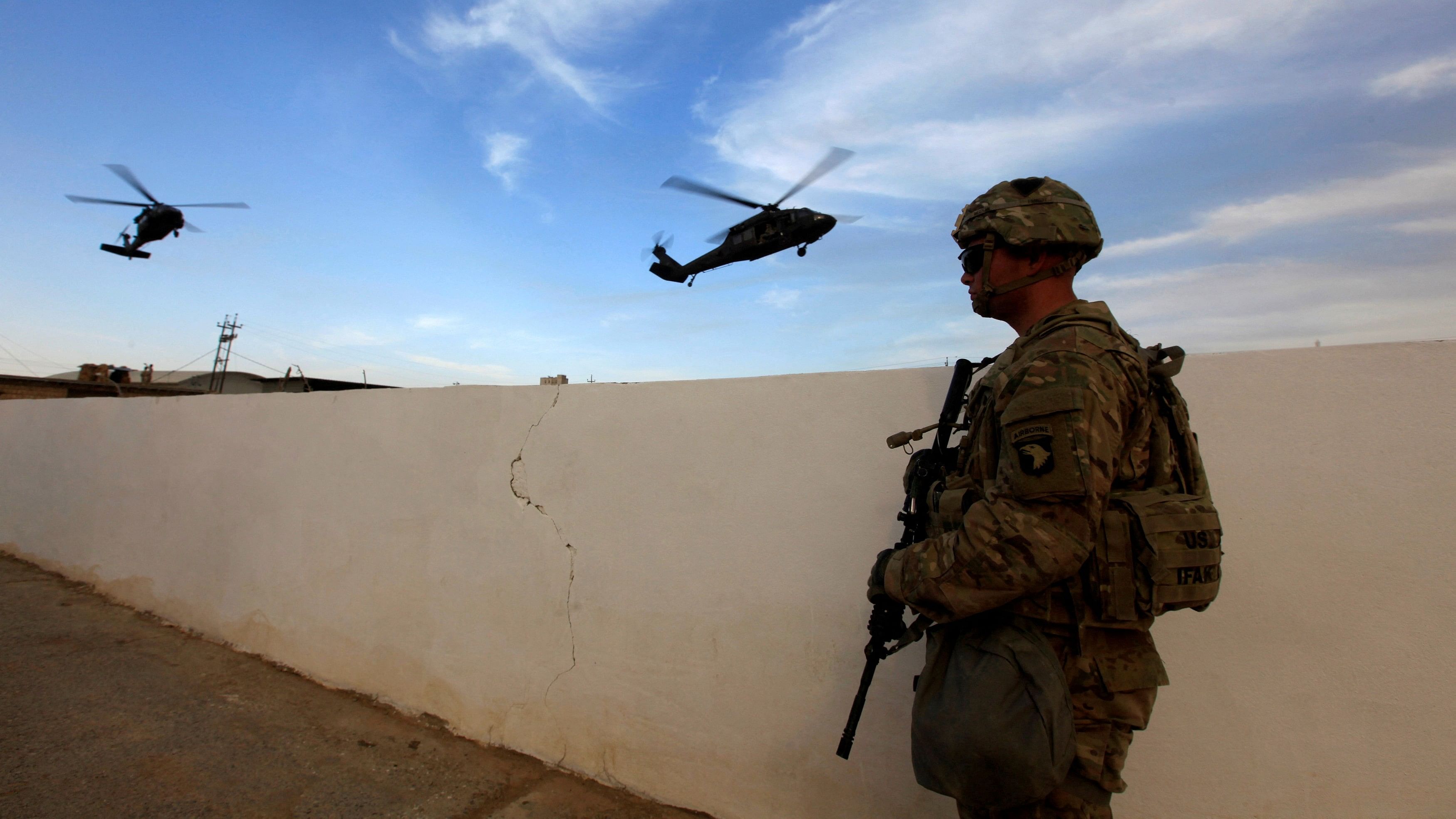 <div class="paragraphs"><p>A US army soldier stands with his weapon at a military base.&nbsp;</p></div>