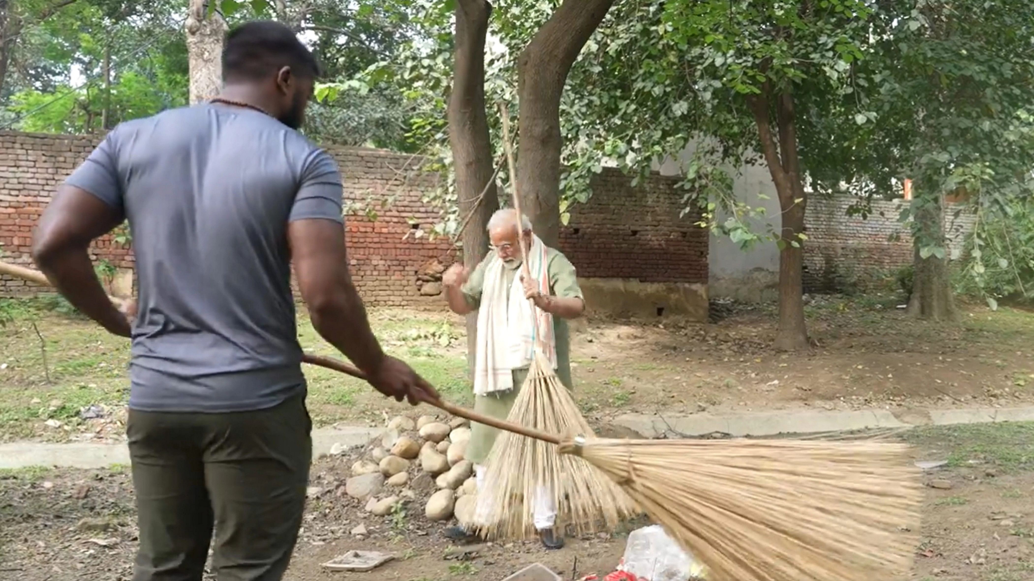 <div class="paragraphs"><p>File Photo: PM Modi with wrestler Ankit Baiyanpuriya participates in a cleanliness drive organised under the 'Swachchta Pakhwada: Swachchta hi Seva' campaign ahead of Gandhi Jayanti, in New Delhi, October 1, 2023. </p></div>