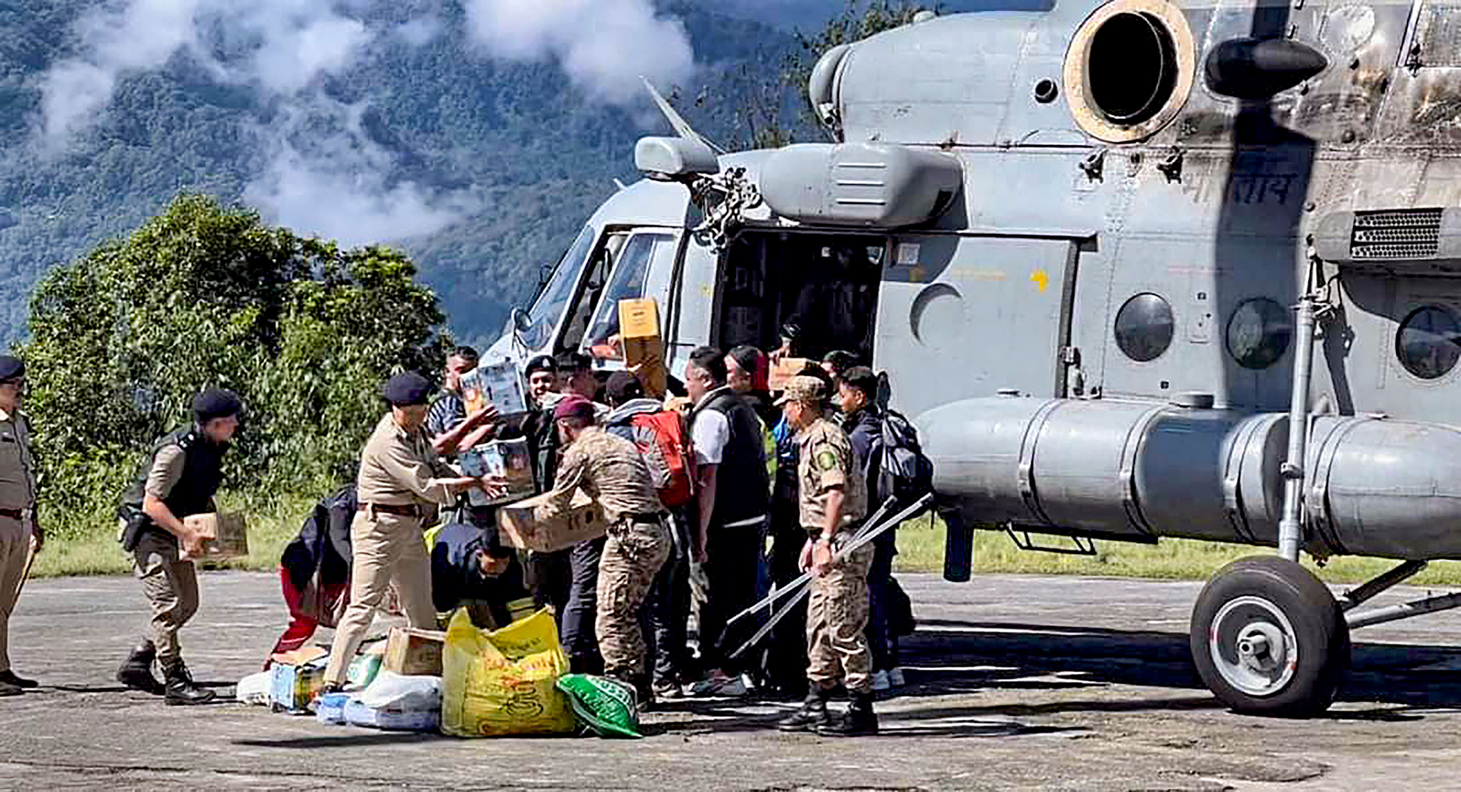 <div class="paragraphs"><p>Tourists evacuated from flood-affected Lachen by helicopter arrive at Ringhim Helipad, Mangan in North Sikkim, Monday, Oct. 9, 2023. </p></div>