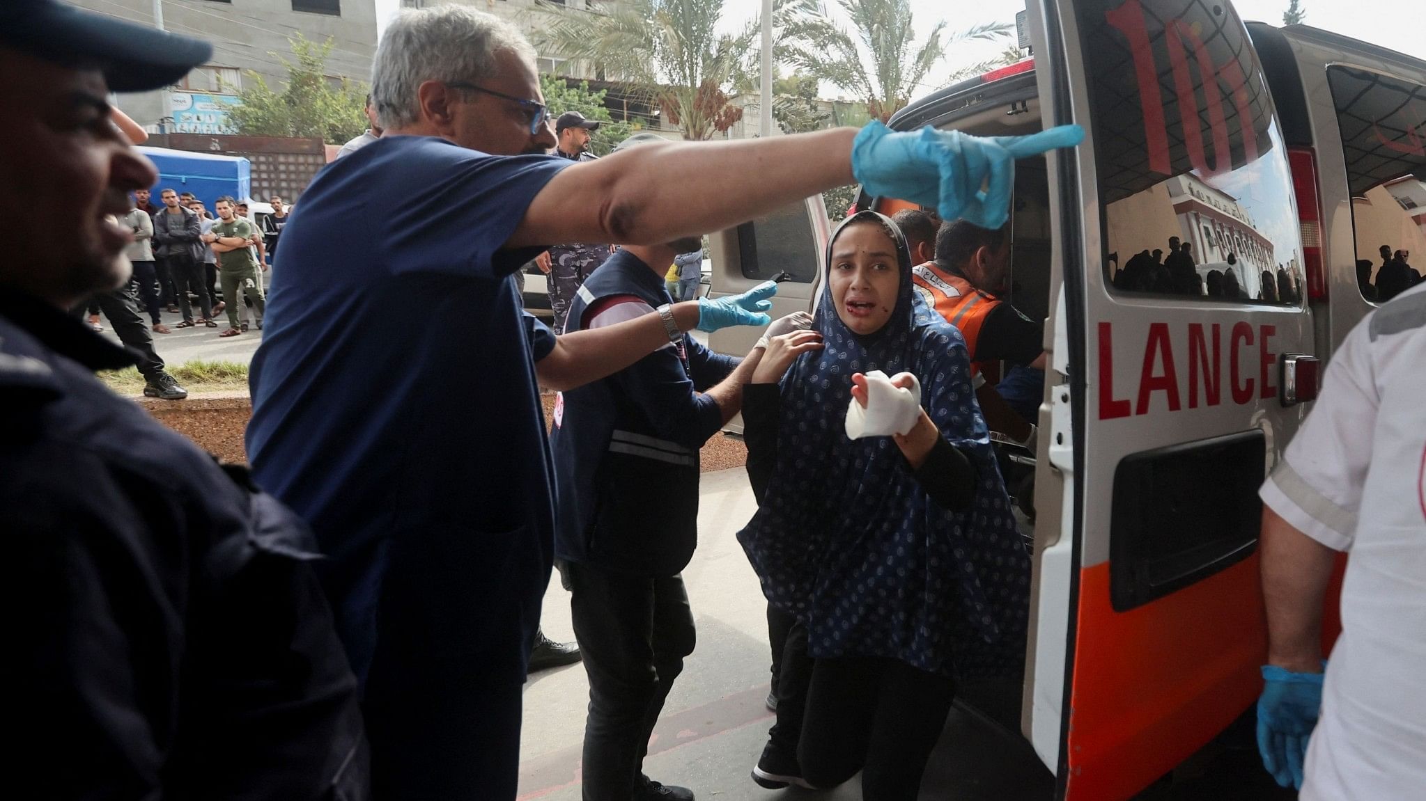 <div class="paragraphs"><p>A woman, wounded in Israeli strikes, arrives at a hospital in Khan Younis in the southern Gaza strip.</p></div>