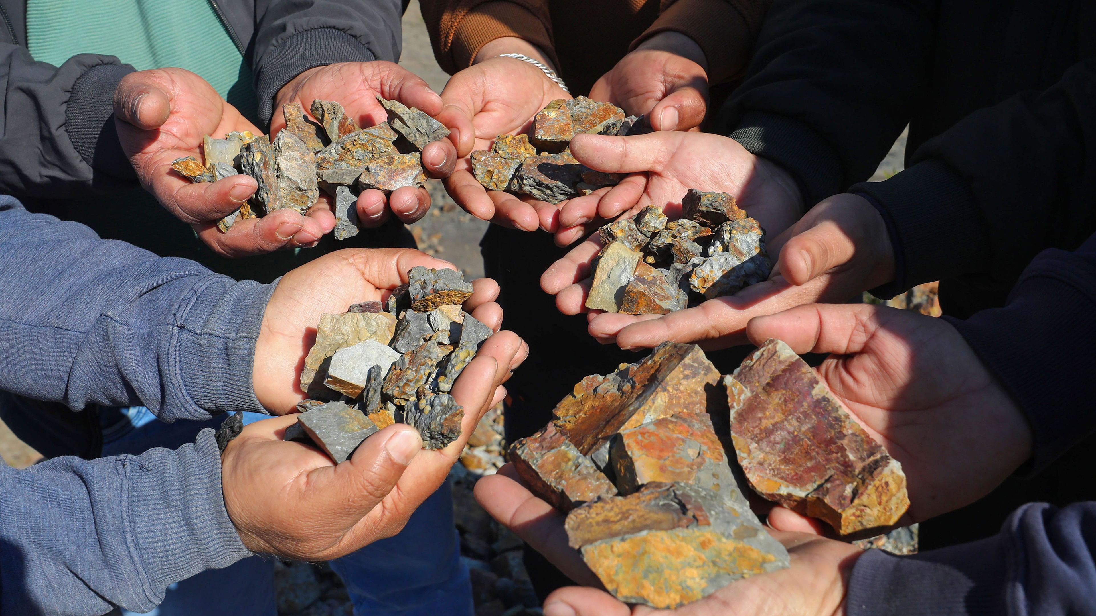 <div class="paragraphs"><p> Villagers show lithium stones in Reasi district, Sunday, Feb. 12, 2023.</p></div>