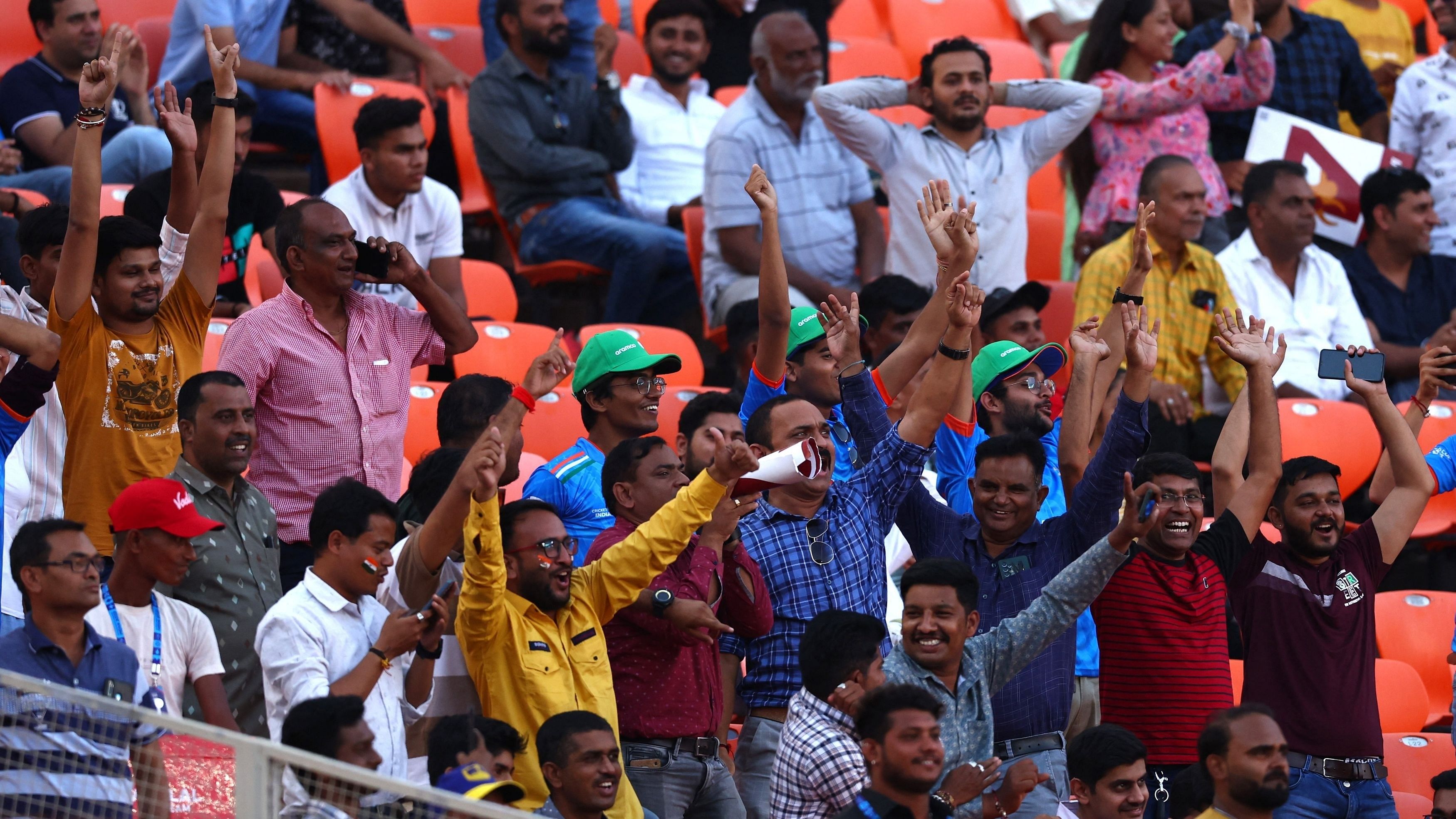 <div class="paragraphs"><p> Fans in the stand react after England's Adil Rashid hits six on the eve of opening match.</p></div>