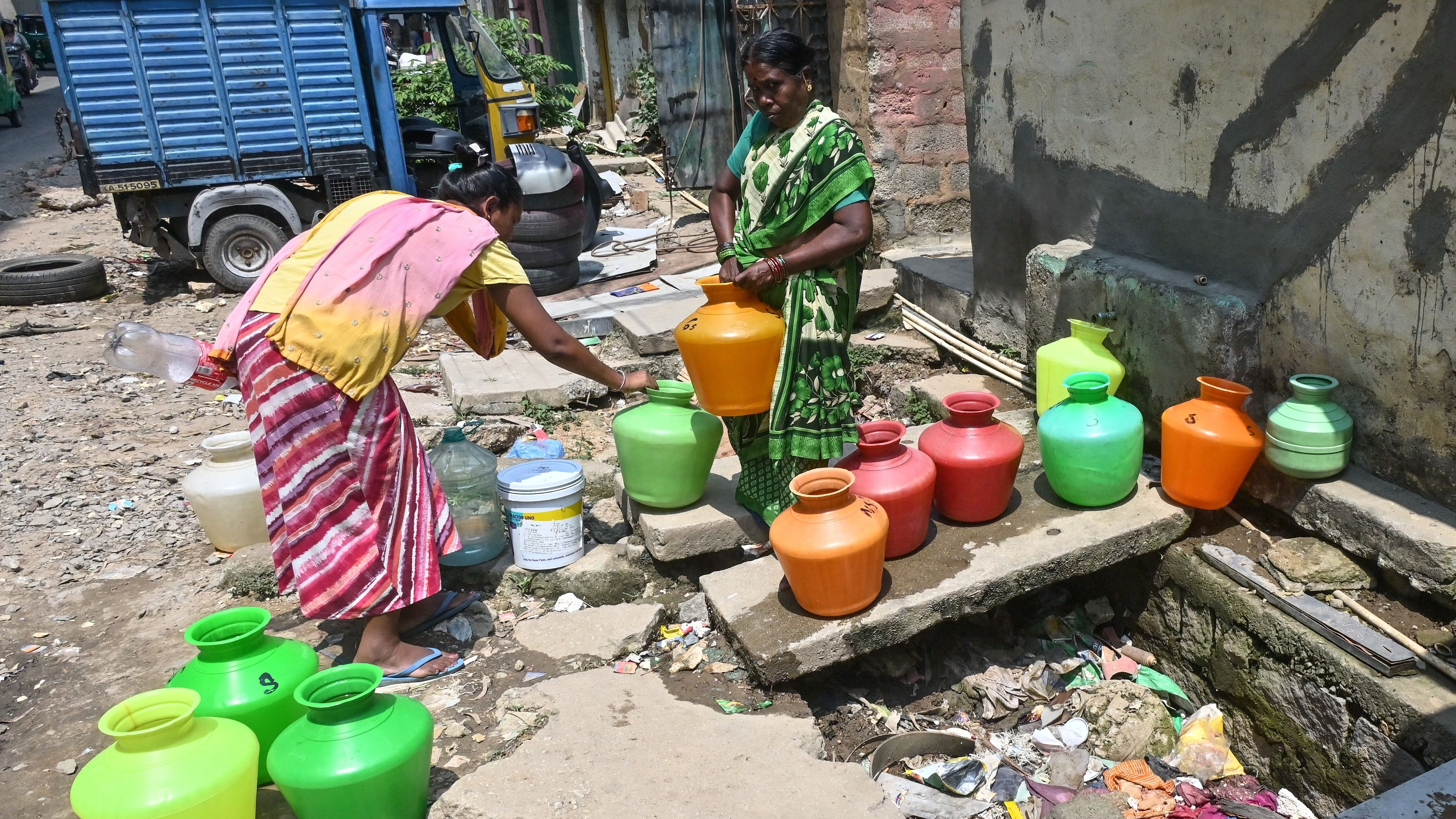 <div class="paragraphs"><p>Women fill water at the public tap at the Jedi Mara Slum in Bannerghatta Road on Tuesday. </p></div>