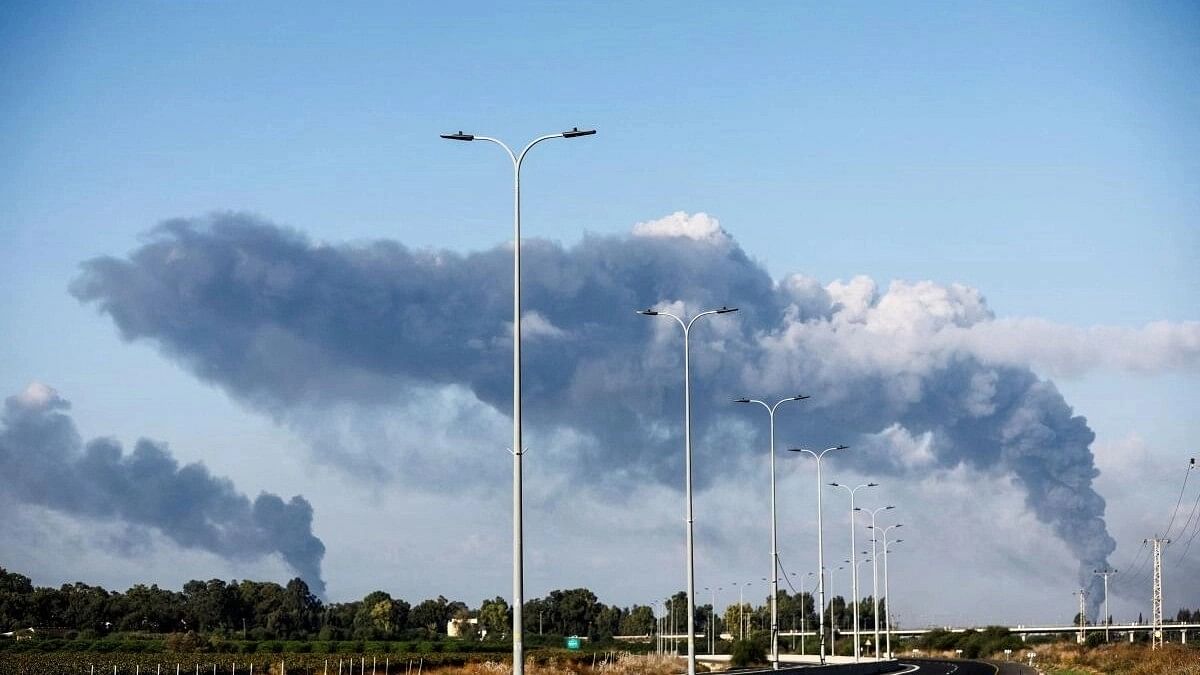 <div class="paragraphs"><p>Smoke is seen as rocket barrages are launched from the Gaza Strip, in Ashdod, Israel. <br></p></div>