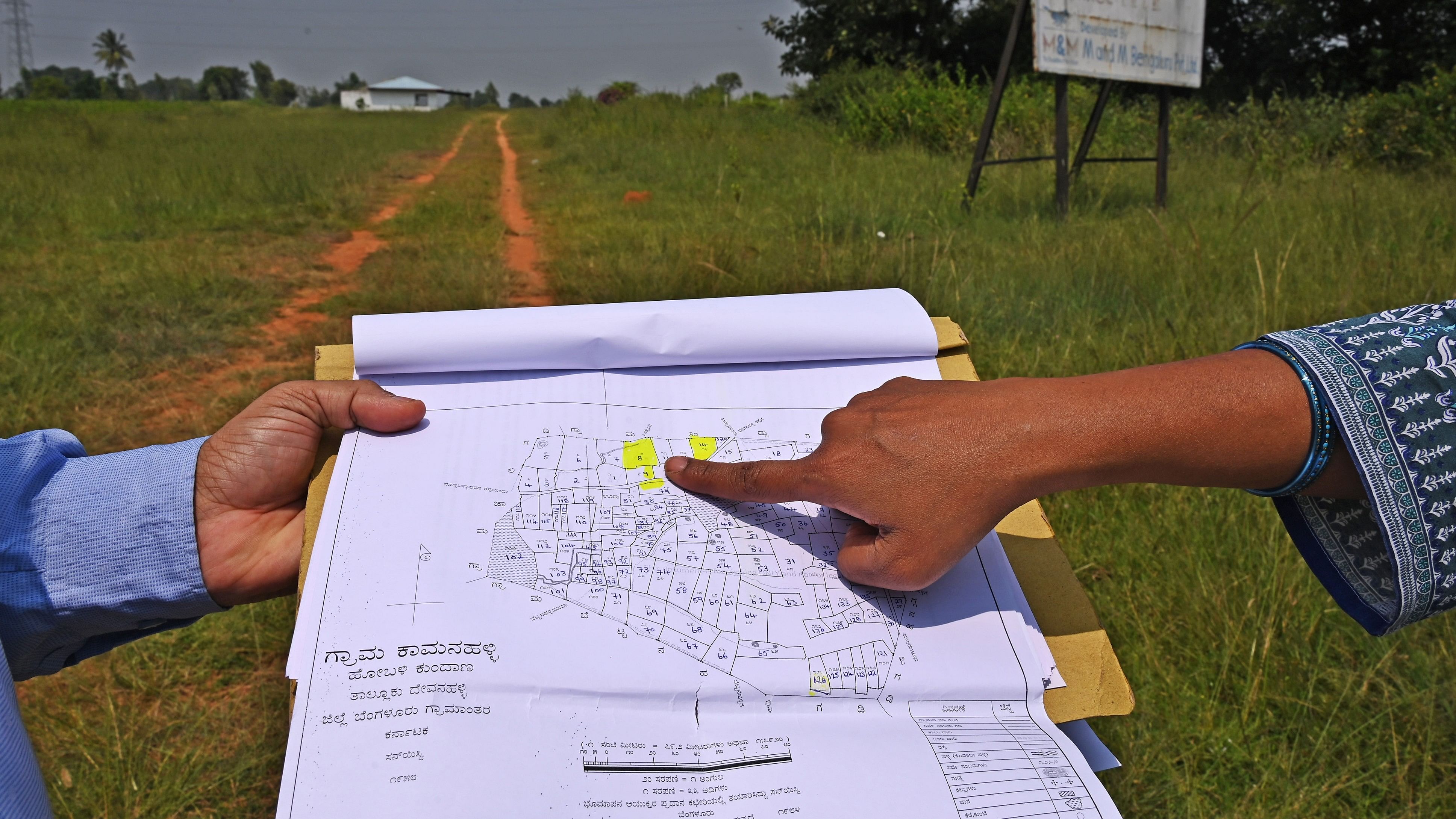 <div class="paragraphs"><p>In the past ten years, 75 co-op societies have been accused of delaying allotment of land. In pic, buyers point to land in a co-op housing society in Thindlu, Doddaballapur. Eleven directors of this society were ousted in July of this year over serious irregularities. </p></div>